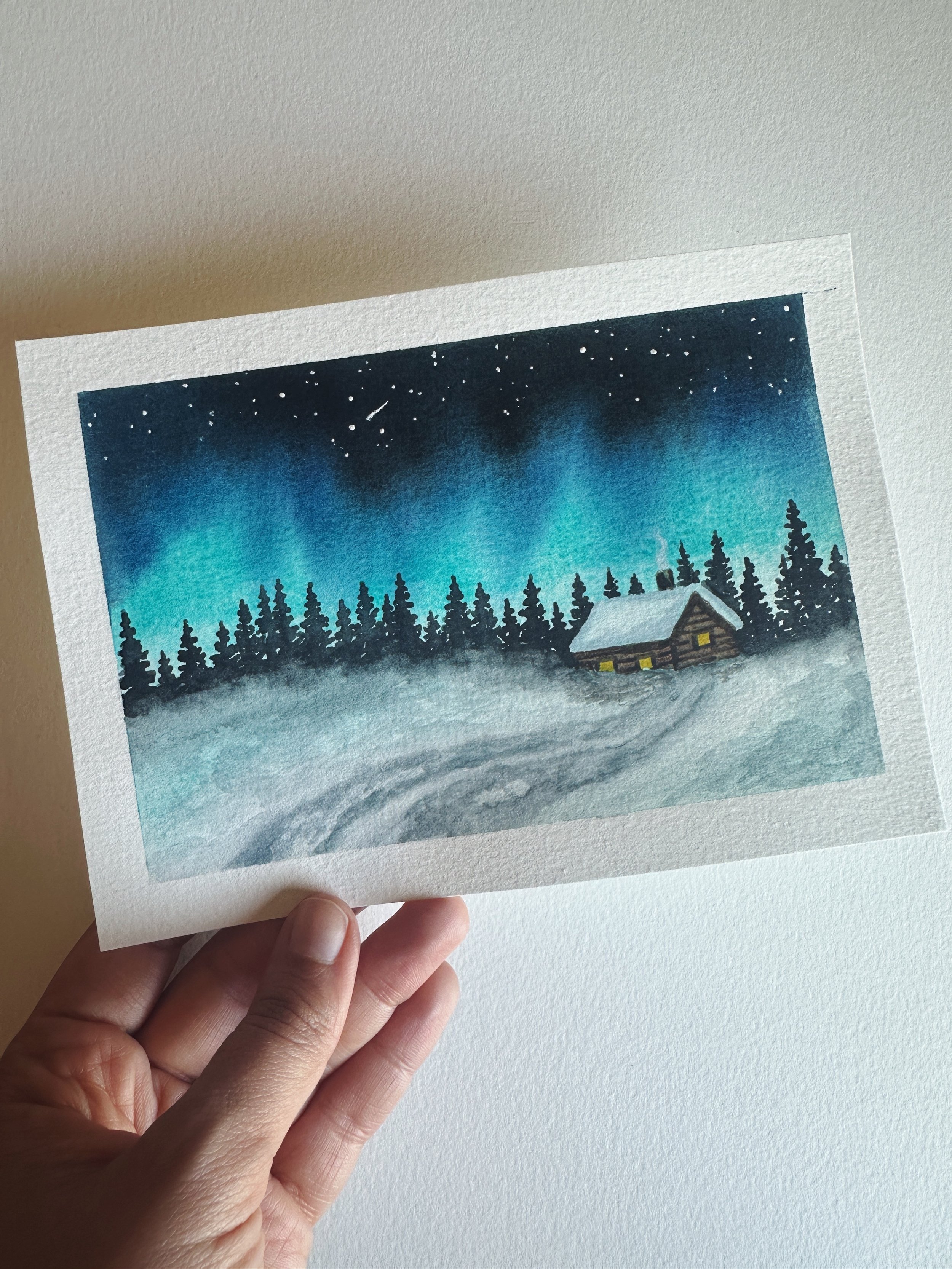 Winter Cabin with Northern Lights