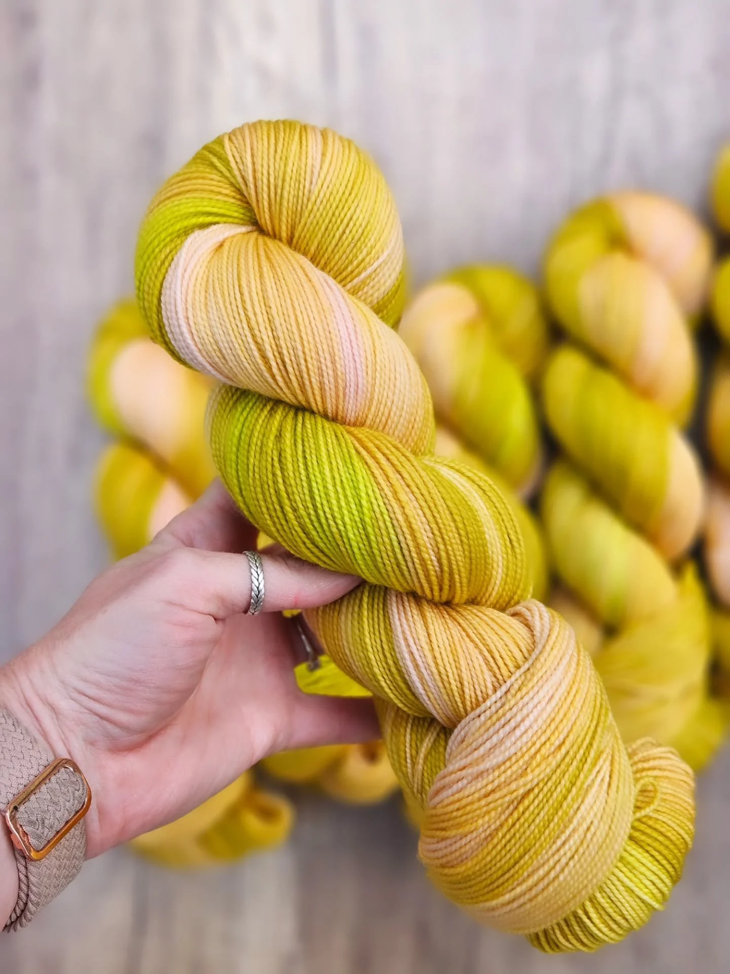 I dyed up some many fun colorways recently for a new wholesale shop so of course we had to do some new Gilmour shots. I'm going to share them with you because it's been so long for quite a few of them.

First up is DAISY BELLY.

Is this not the perfe