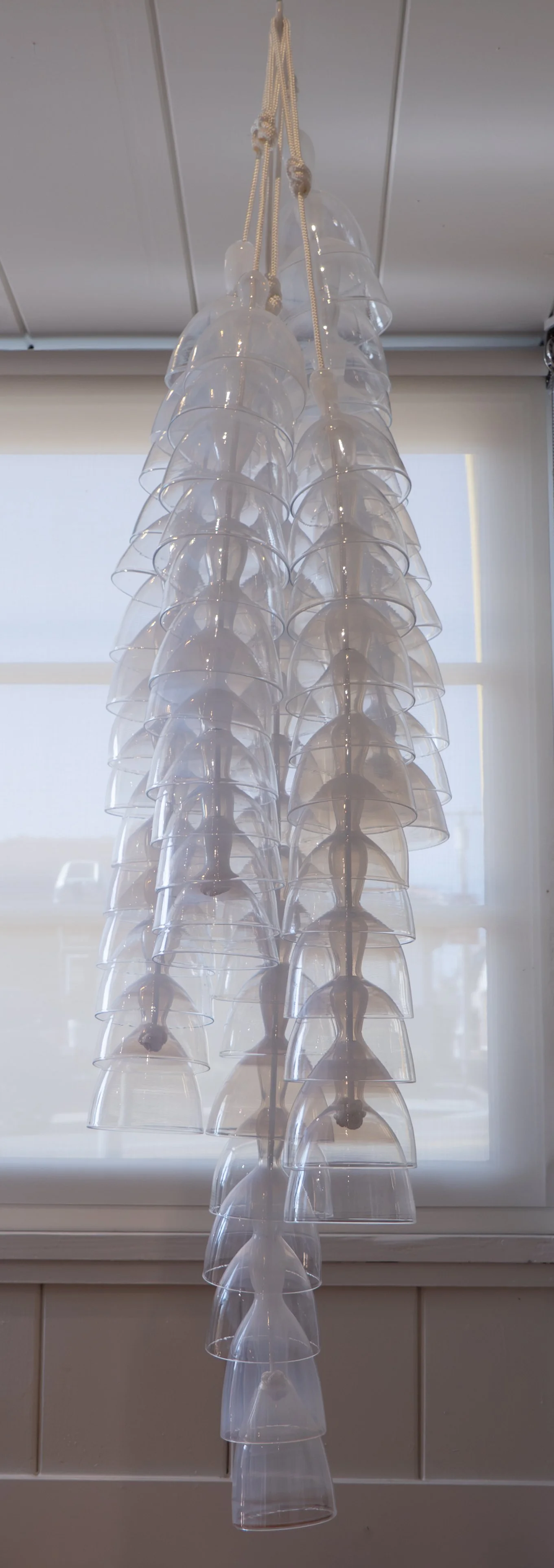 CARMEN SALAZAR  
Tendrils (2026)  
61” x 5”  
Opaline hand blown glass and rope  
$14,000