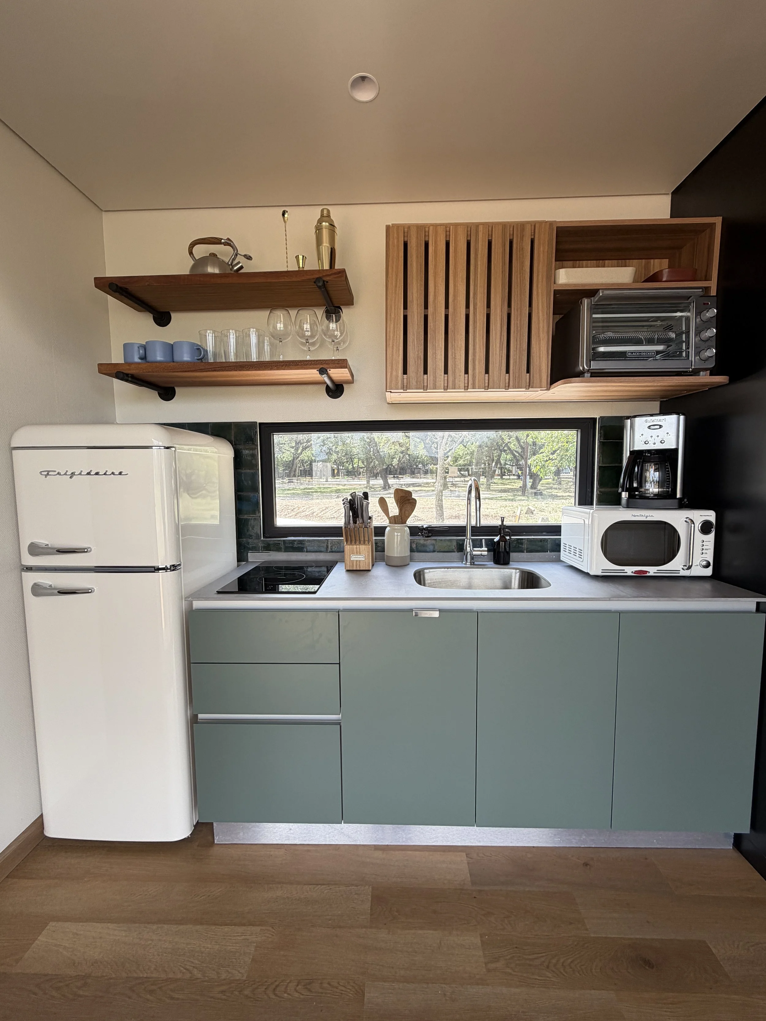 Even the kitchen has a view in a Getaway Cabin at Camp Cold Springs in Concan, Texas.