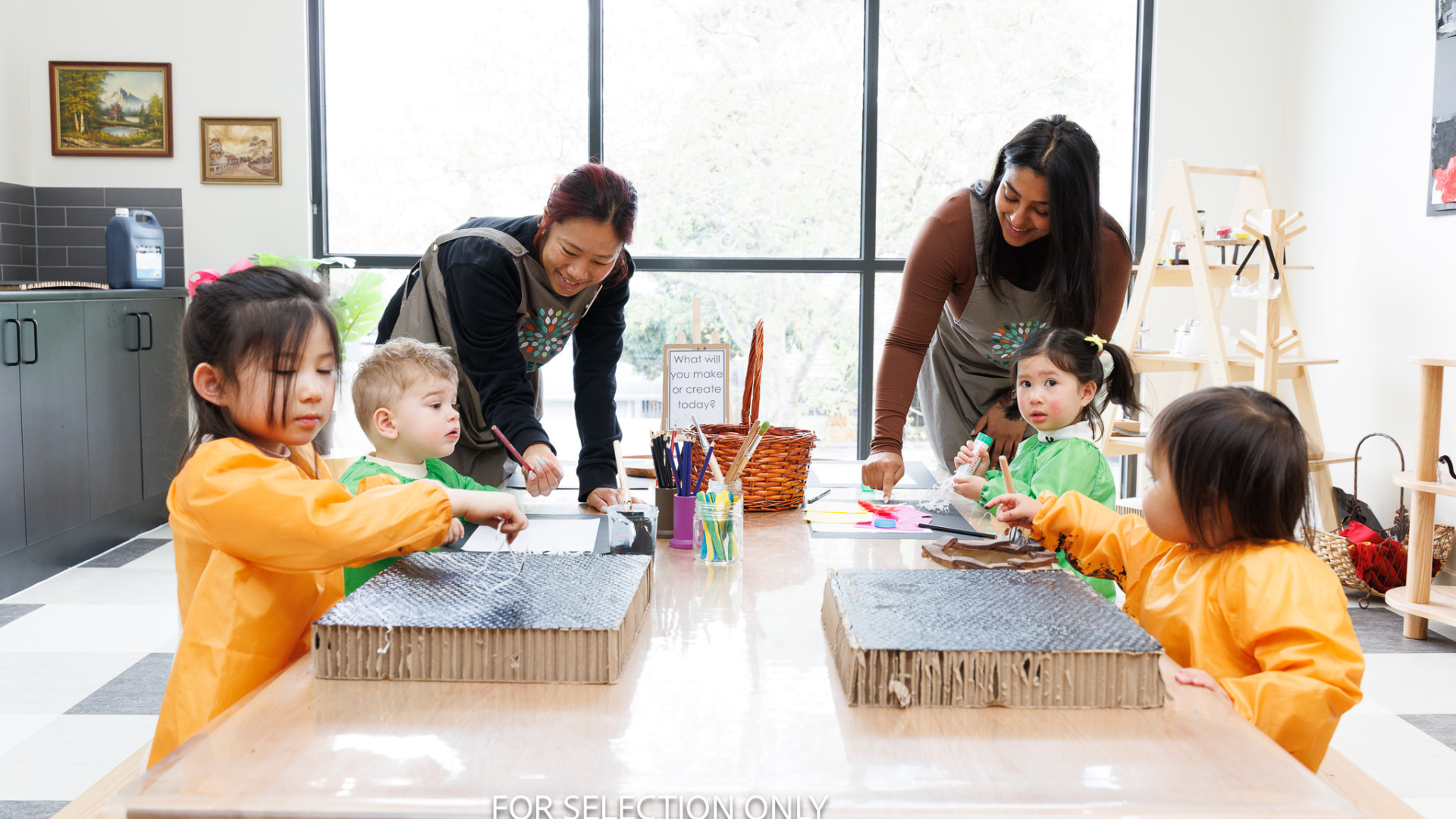 Educators working with children on a hands-on activity at Treetop Early Learning. This scene reflects collaborative learning, nurturing guidance, and the value of interactive experiences in early education.