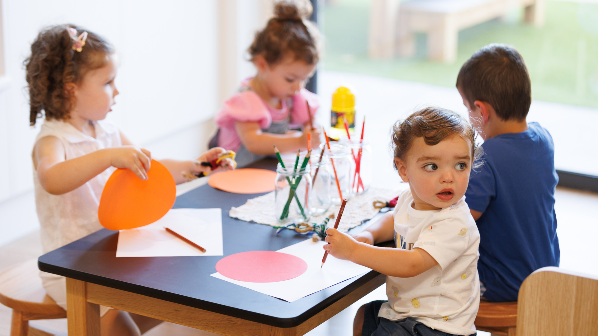 A child engaged in an art activity at Treetop Early Learning. Painting and creative expression help develop fine motor skills, imagination, and confidence in a supportive setting.