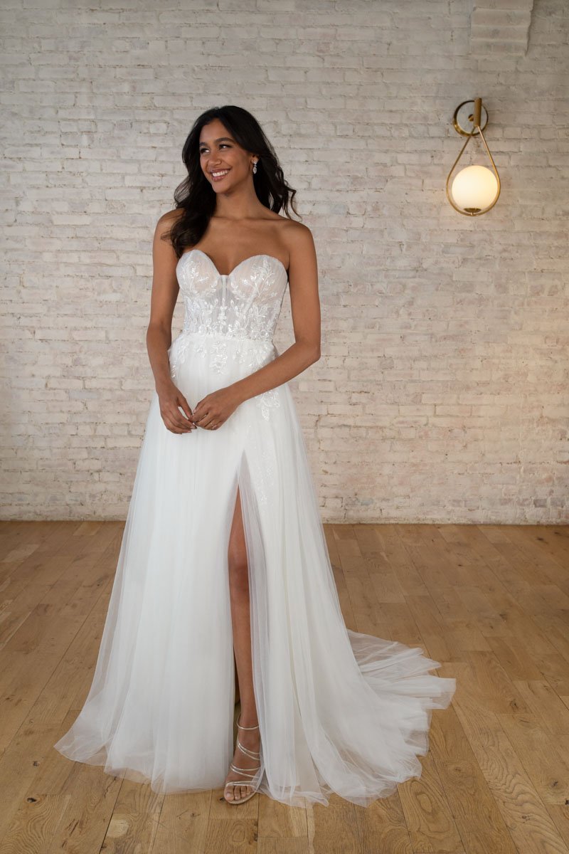 Stella York 7740 off-the-shoulder sweetheart A-line wedding dress in sparkle tulle and sequin lace with slit and sheer back in Ivory/Almond