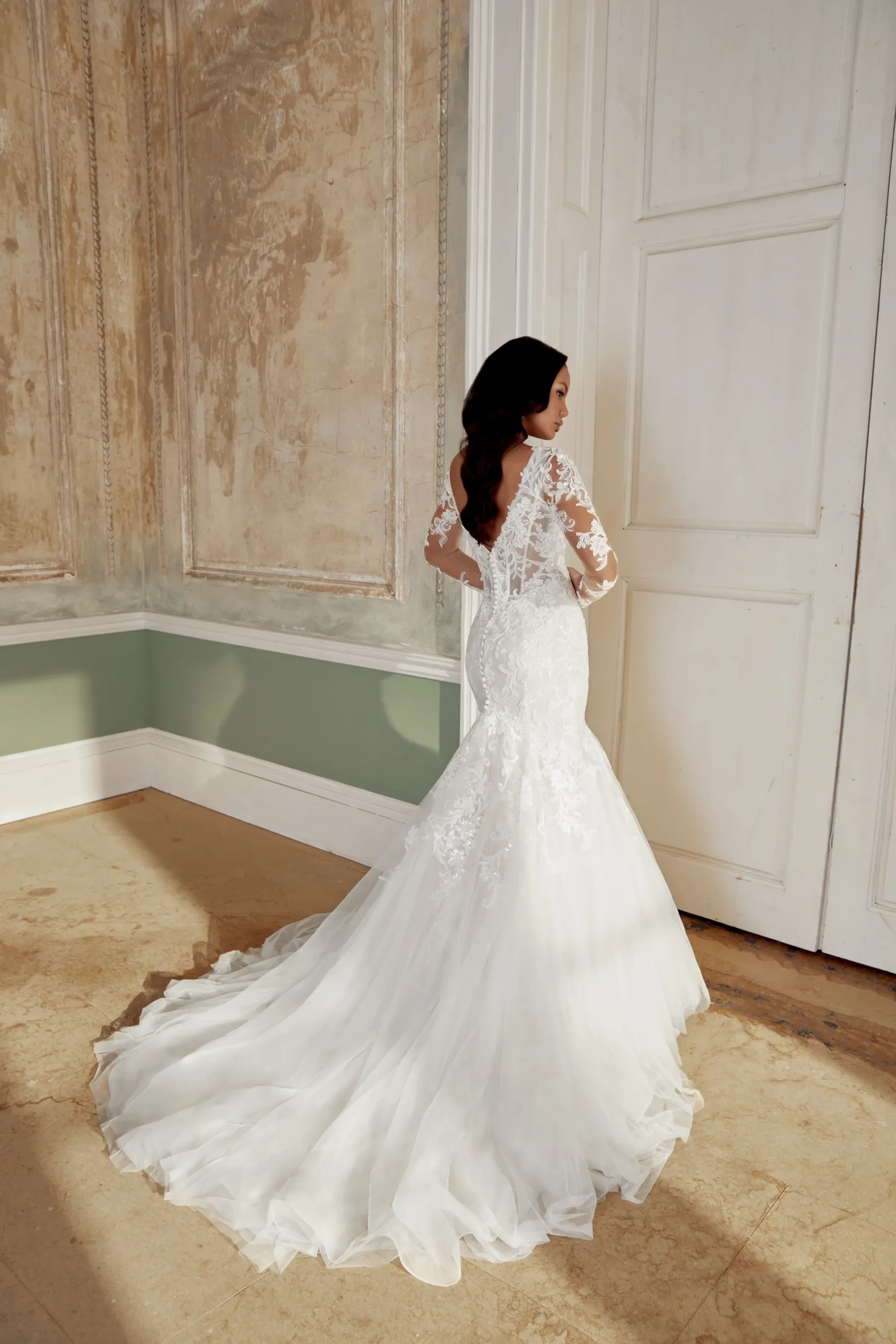 Sincerity 44542 — plus-size mermaid wedding dress with V-neckline, basque waist, sequined lace appliqués, 3D petal details, lace sleeves, and chapel train
