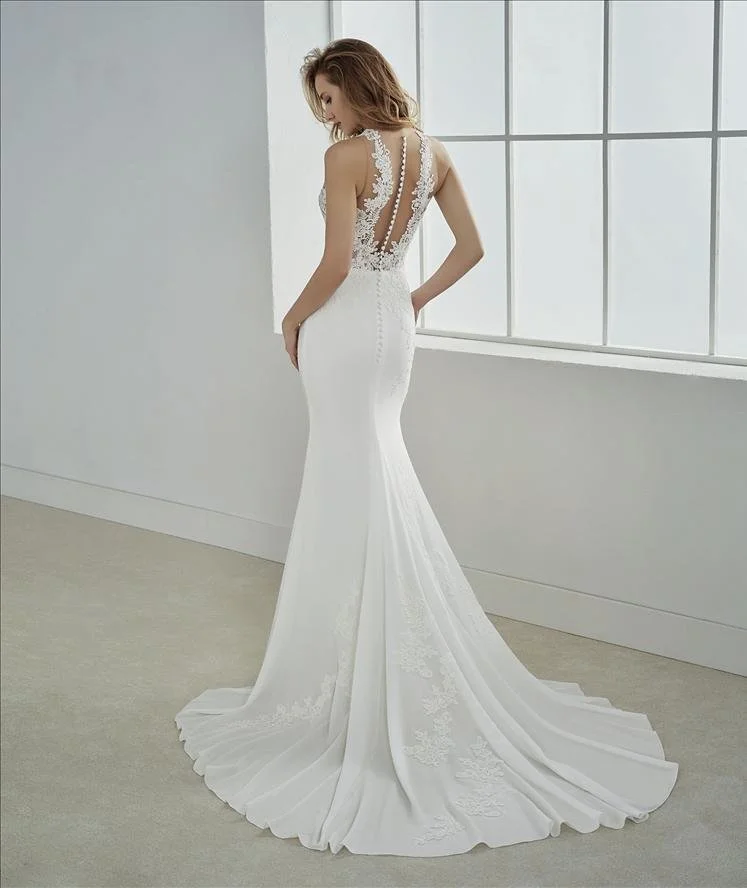 White One Filipinas Mermaid wedding gown in Crepe, bridal sample size 8 available at Olive and Ivory Bride Sacramento