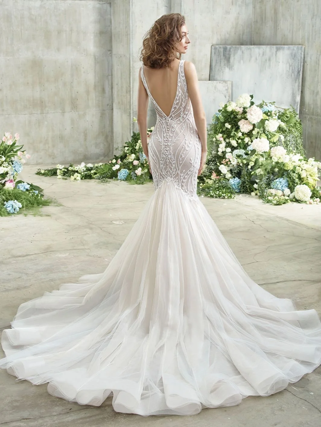 Badgley Mischka Bride Ellie mermaid wedding dress with sparkling glitter tulle, swirling botanical beaded lace, illusion V-neckline, and low V-back