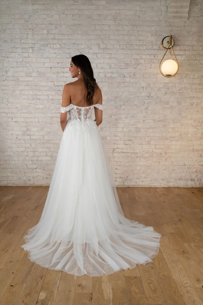 Stella York 7740 off-the-shoulder sweetheart A-line wedding dress in sparkle tulle and sequin lace with slit and sheer back in Ivory/Almond