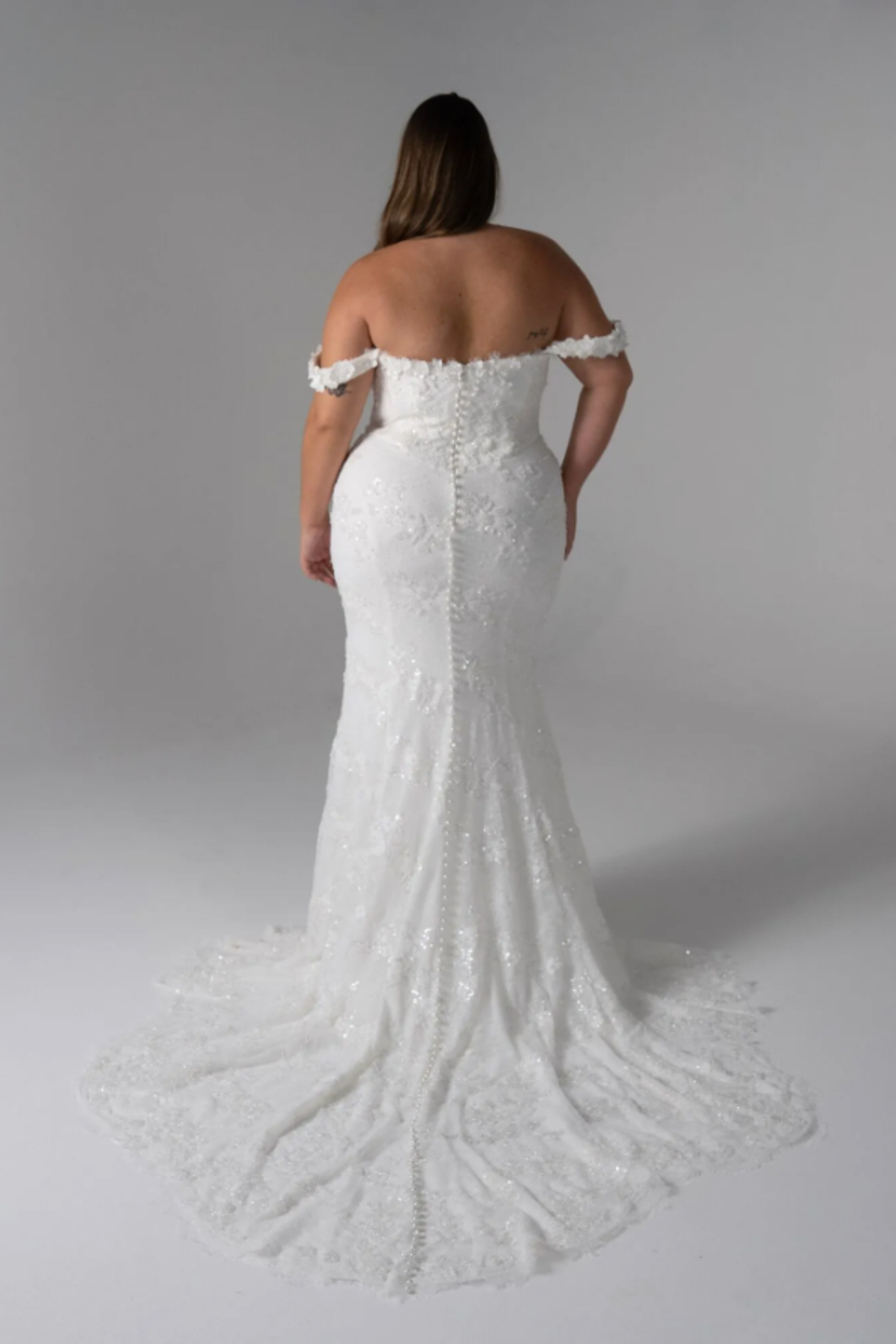 Serene Vendela fit-and-flare wedding dress with scoop neckline, 3D floral motifs, sequin lace, and Basque waist