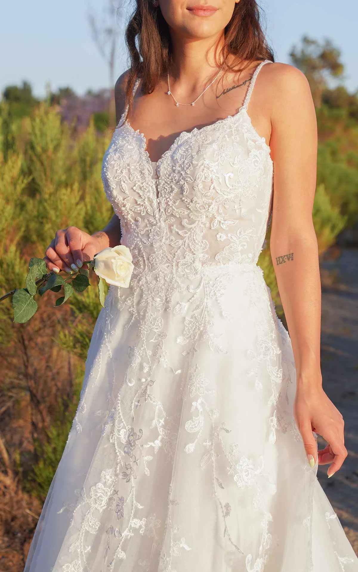 Romantic Floral Wedding Dress with Sheer Bodice and Full Skirt