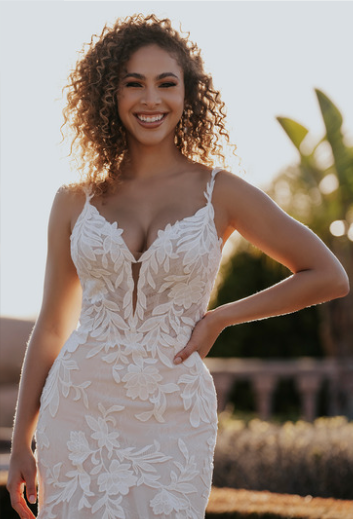 Allure Bridals A1156 fit and flare lace wedding dress with matte lace appliques over Chantilly lace, plunging neckline, and open low back