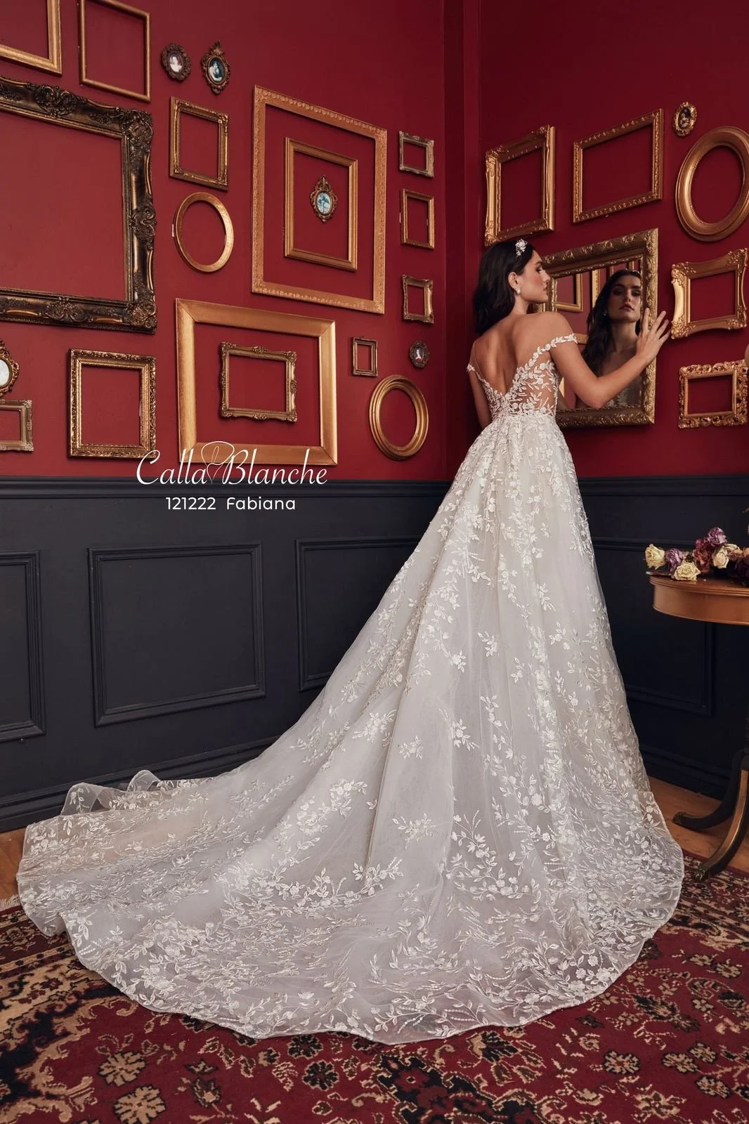 Calla Blanche Fabiana 121222 A-line wedding dress with illusion cap sleeves, plunging V-neckline, and flowing lace skirt with pockets