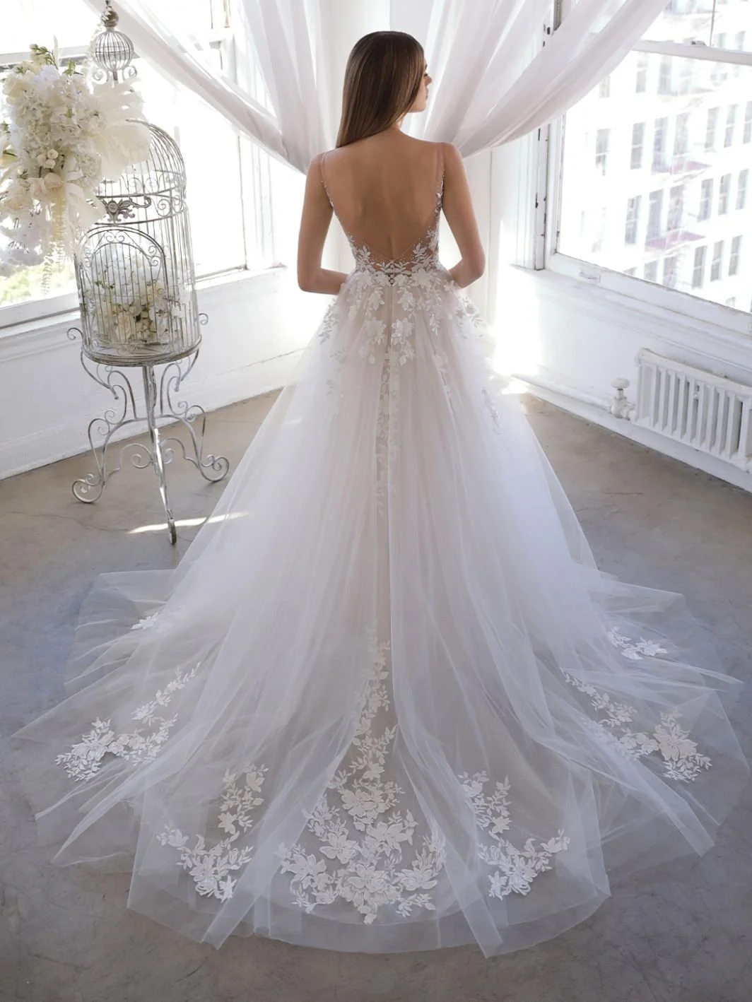 Enzoani Blue Olani A-line wedding dress with illusion V-neckline, beaded 3D floral lace, organza and glitter tulle skirt