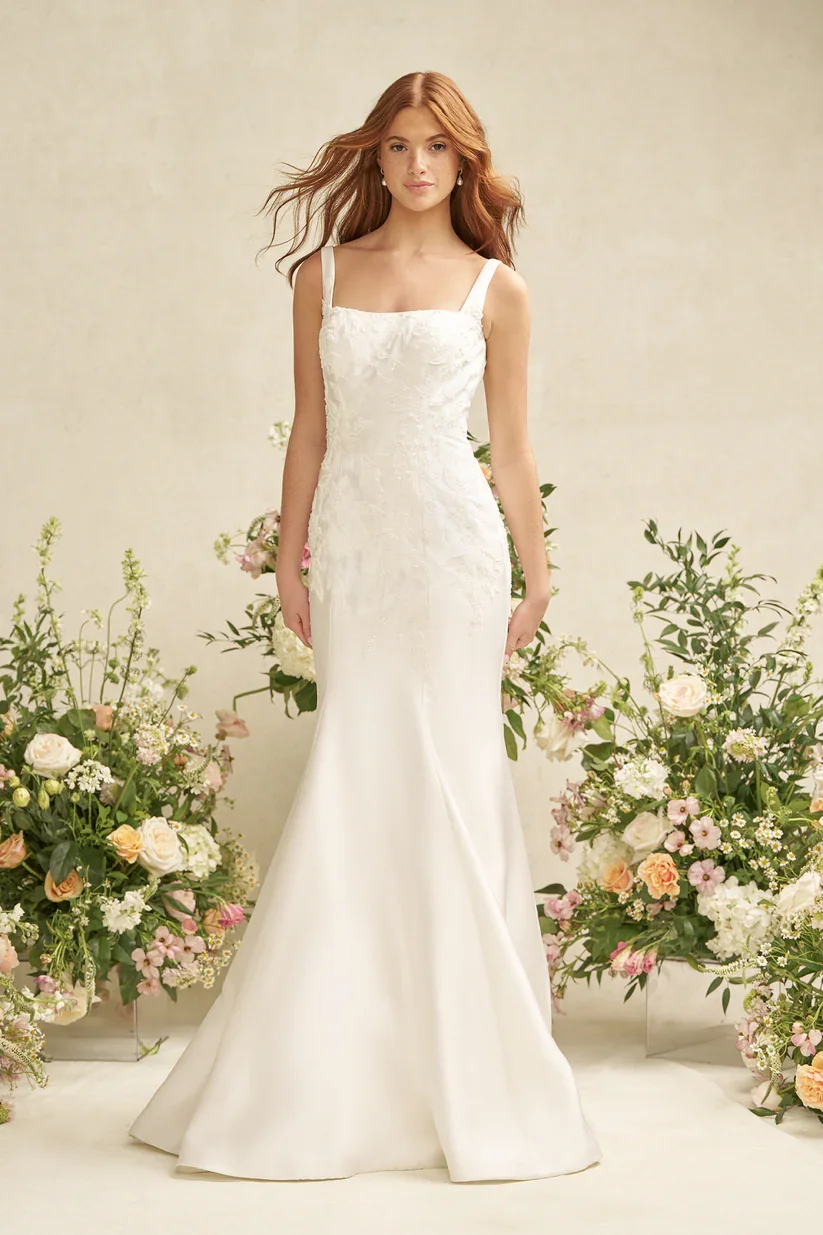Fit and flare Mikado wedding dress with square neckline, wide straps, and beaded lace appliques