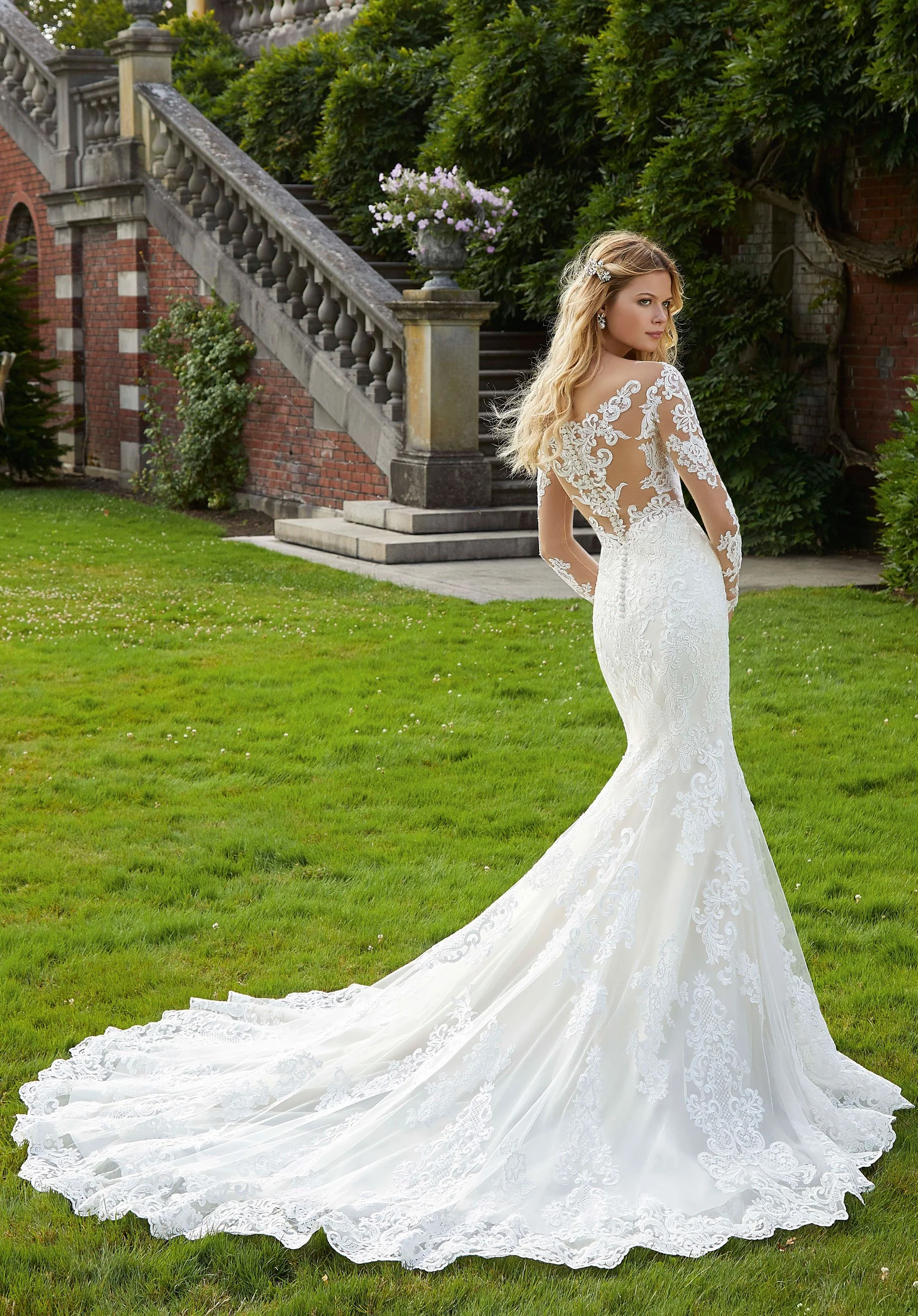 Mori Lee Philomena 2040 fit-and-flare wedding gown with long sleeves, frosted Alencon lace appliqués, and wide scalloped tulle hemline