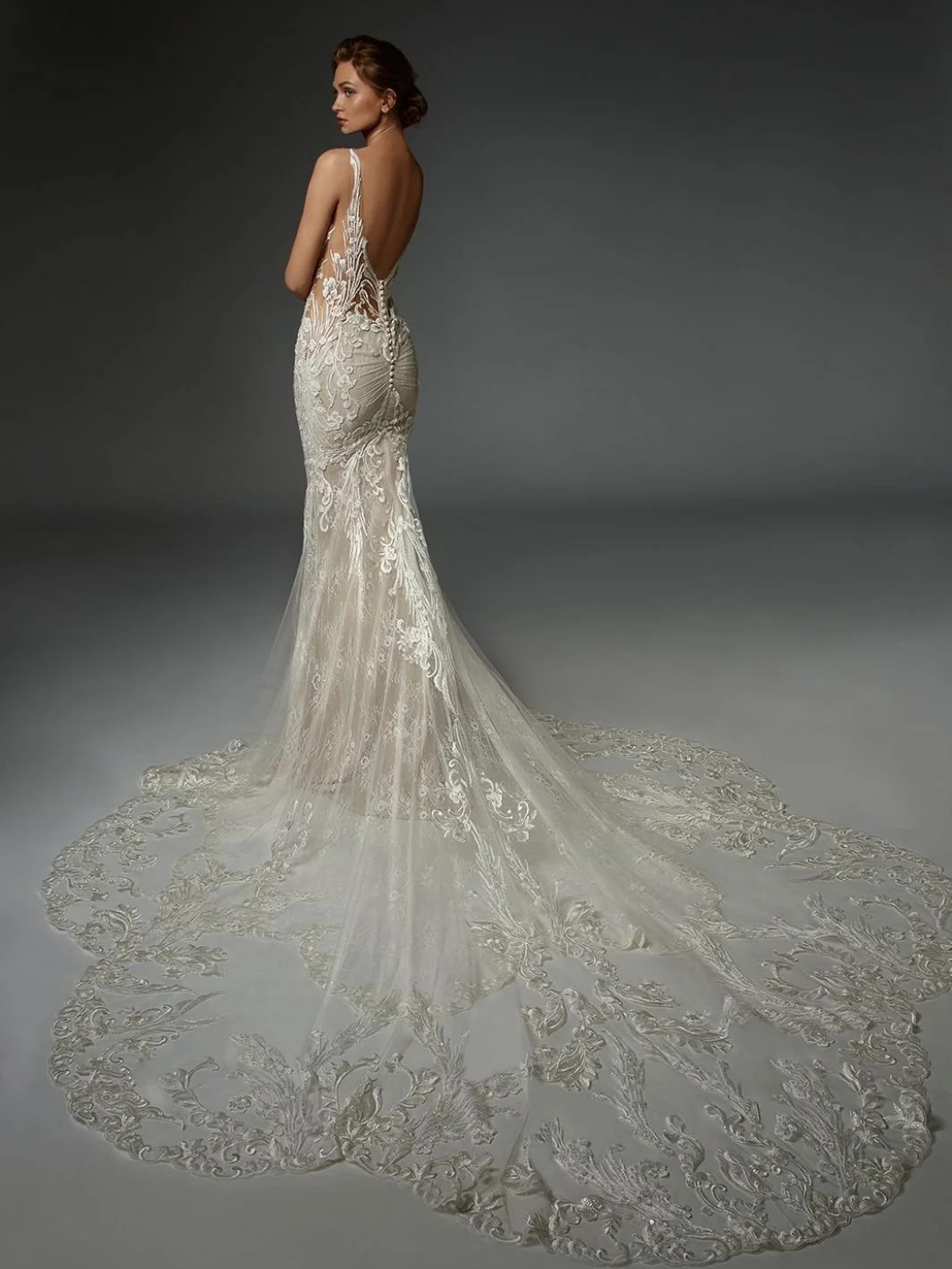 Elysse Francoise floral baroque lace wedding dress with hand-embroidered beads, paillettes, deep side cutouts, and sculpted baroque lace train