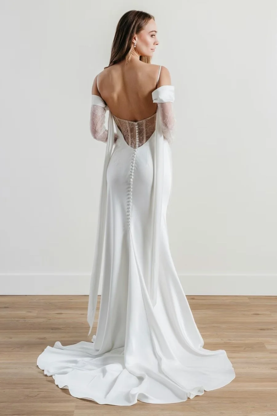 sheath wedding dress in charmeuse and lace with sweetheart neckline, detachable off-the-shoulder sleeves, and removable arm drapes