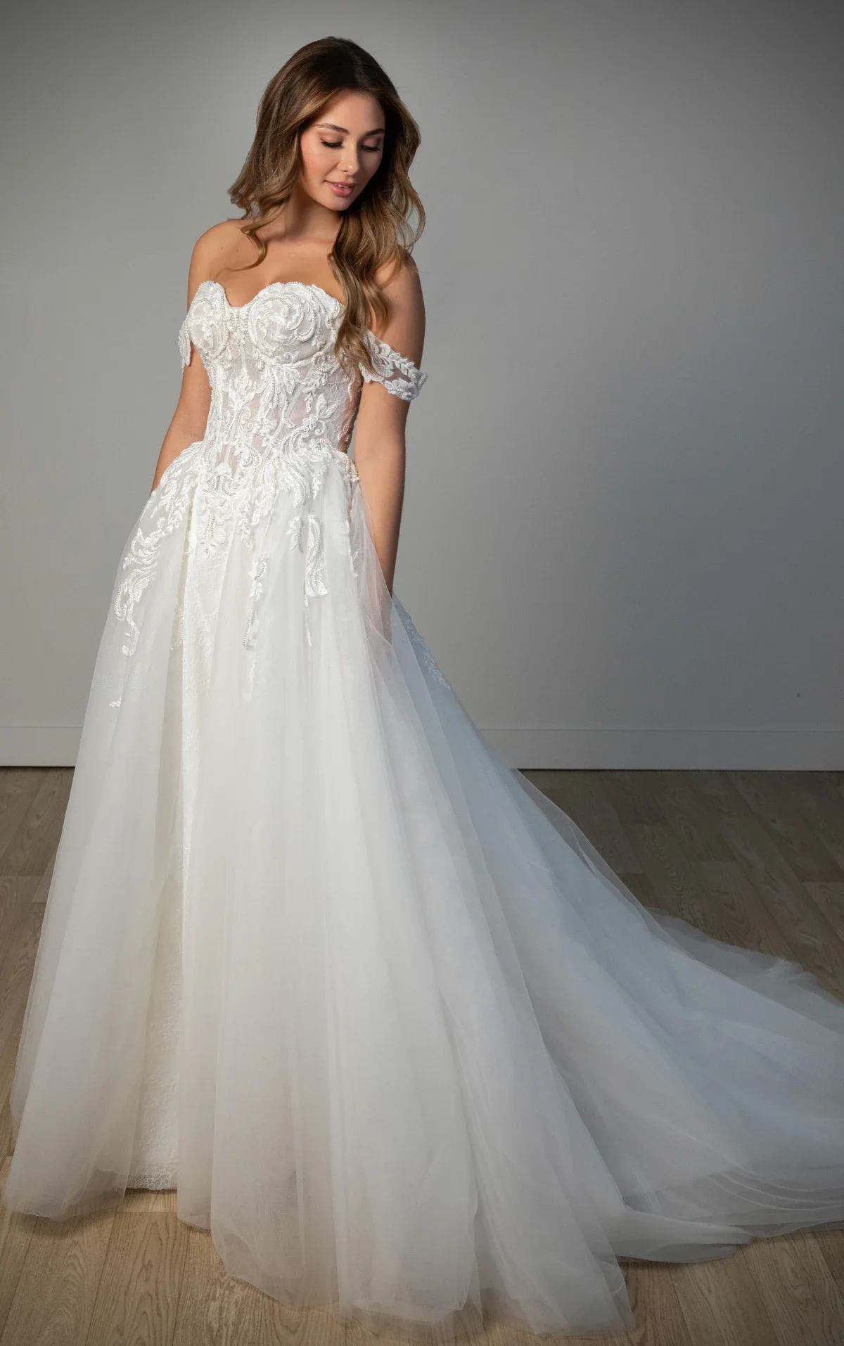 Stella York SY8345 off-the-shoulder A-line wedding gown in lace and tulle with detachable floral straps and sweetheart neckline