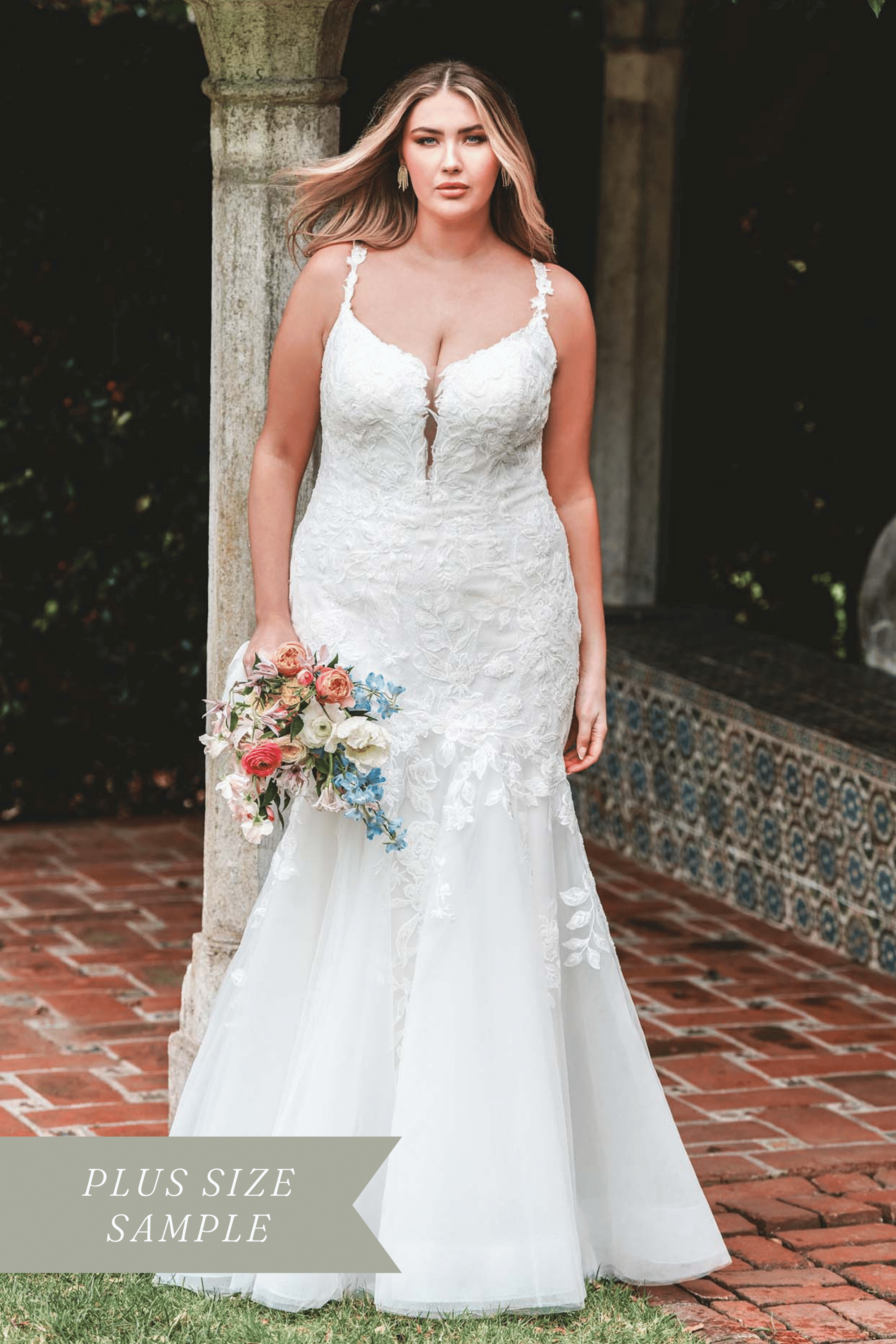 This strappy fit and flare gown features a matte floral applique over sparkle tulle.