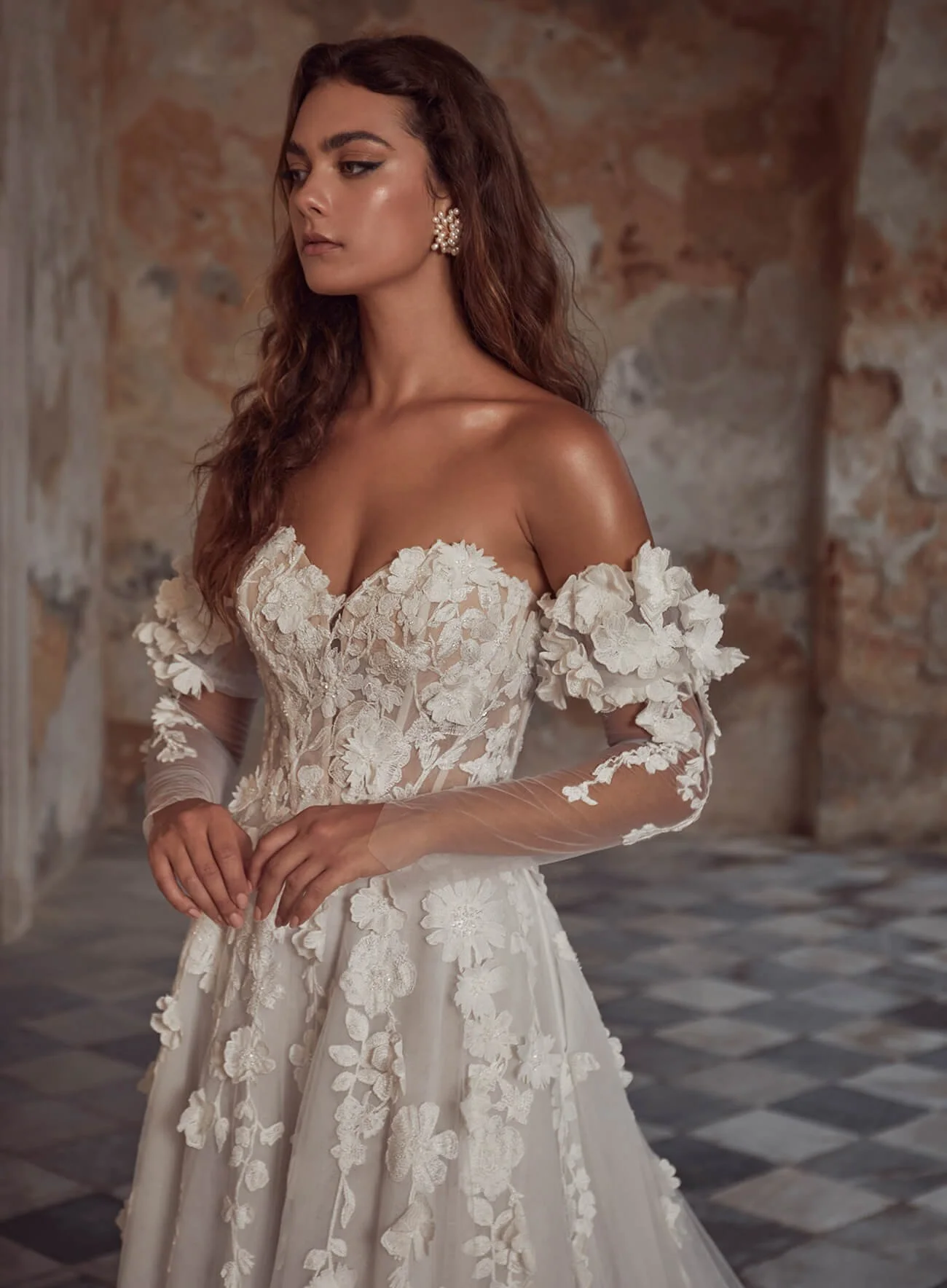 Calla Blanche Shania 123111 strapless A-line wedding dress with 3D floral lace, detachable long sleeves, and pockets