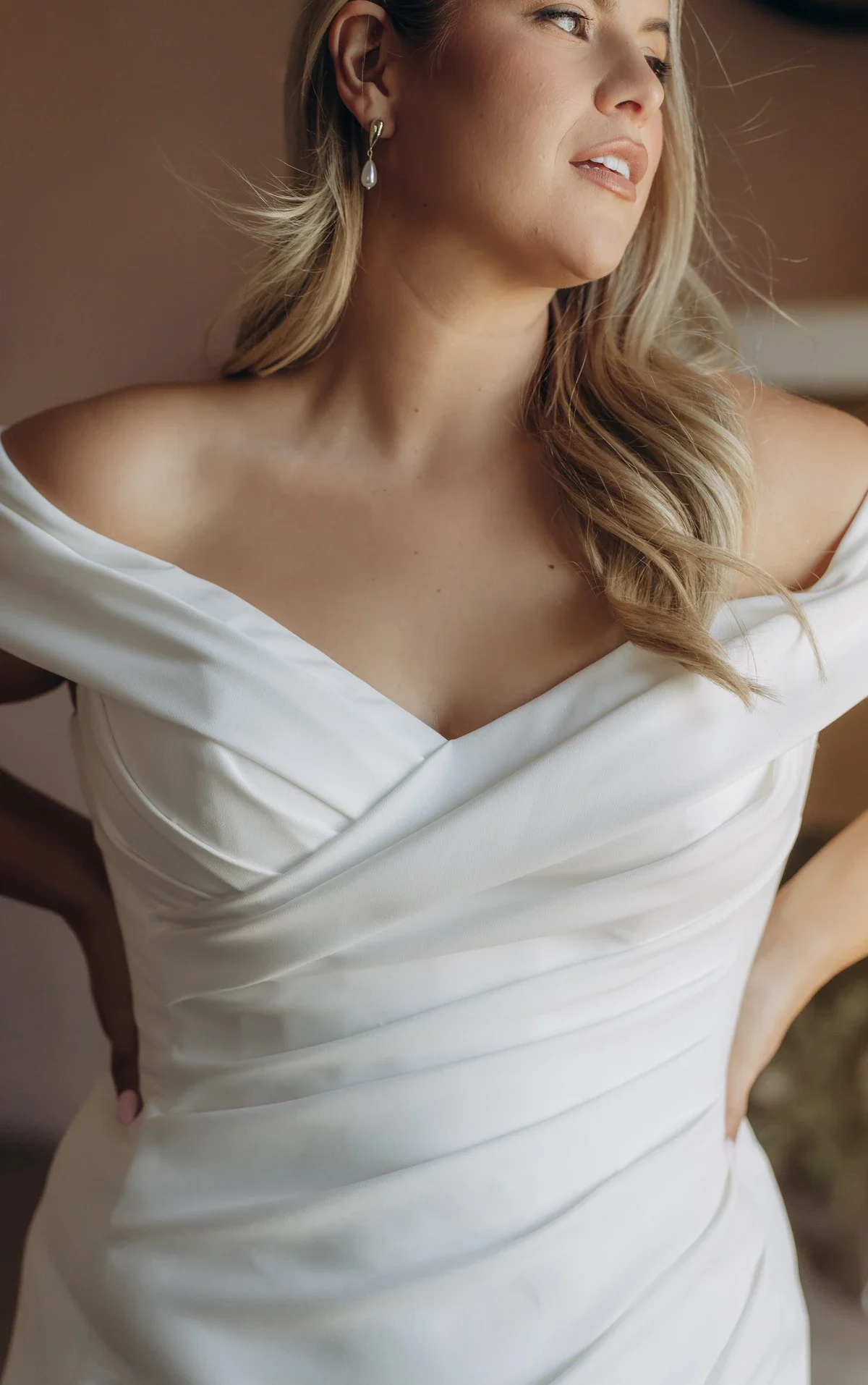Stella York SY8330 off-the-shoulder trumpet wedding gown in stretch crepe with ruched bodice and fit-and-flare silhouette