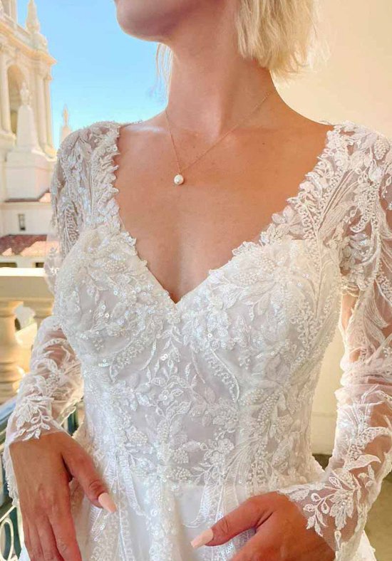 Essense of Australia D3700IV long sleeve A-line lace wedding dress with V-neckline, open back and high slit