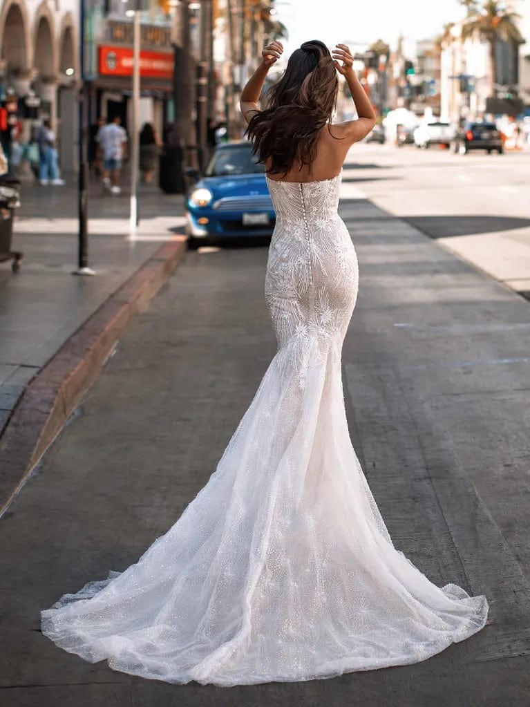 Pronovias Lansbury mermaid wedding dress with embroidered lace, tulle layers, sweetheart neckline, and chapel train