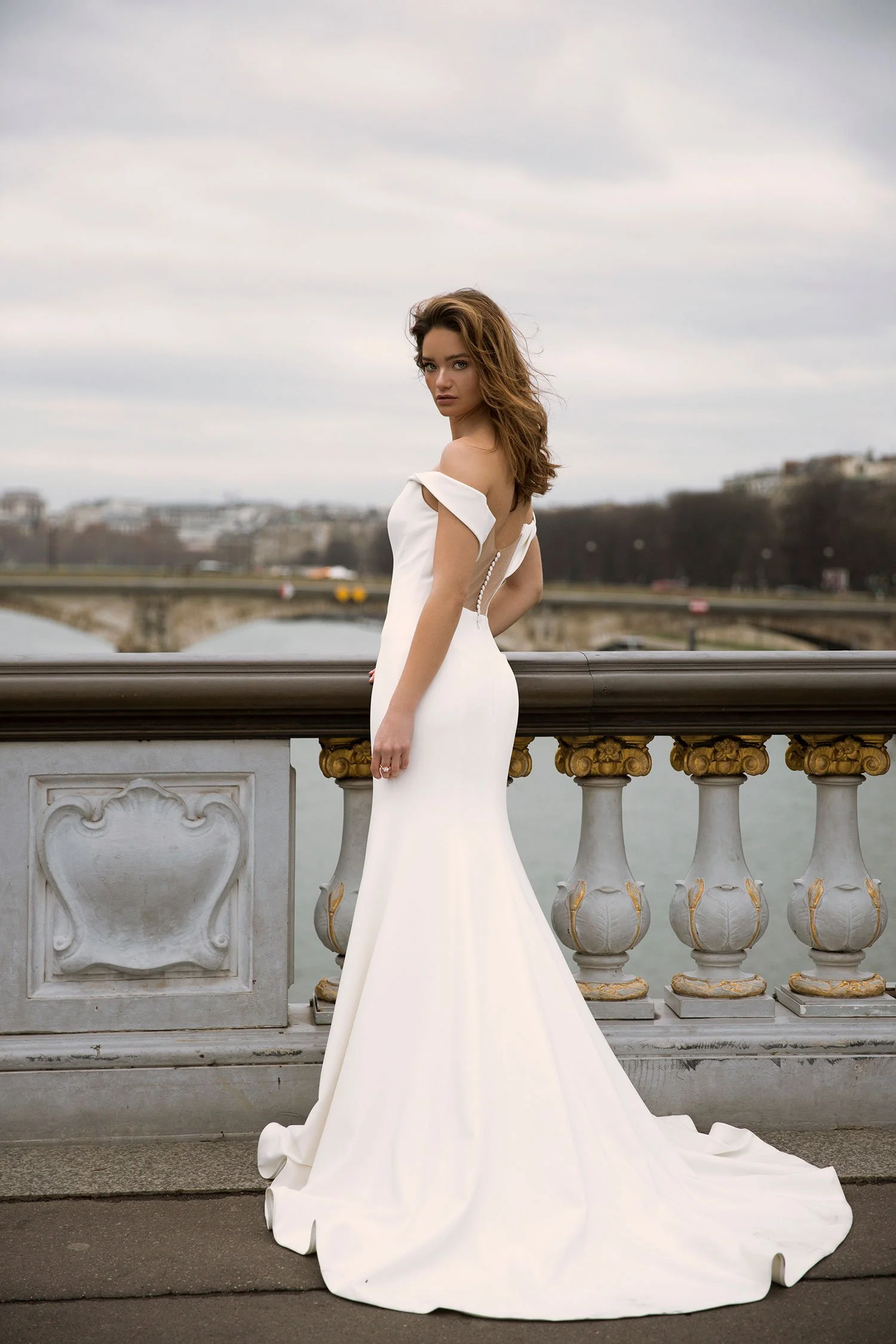 Madi Lane Fallon Bridal wedding gown with Off the Shoulder neckline in Crepe, bridal sample size 8 available at Olive and Ivory Bride Sacramento