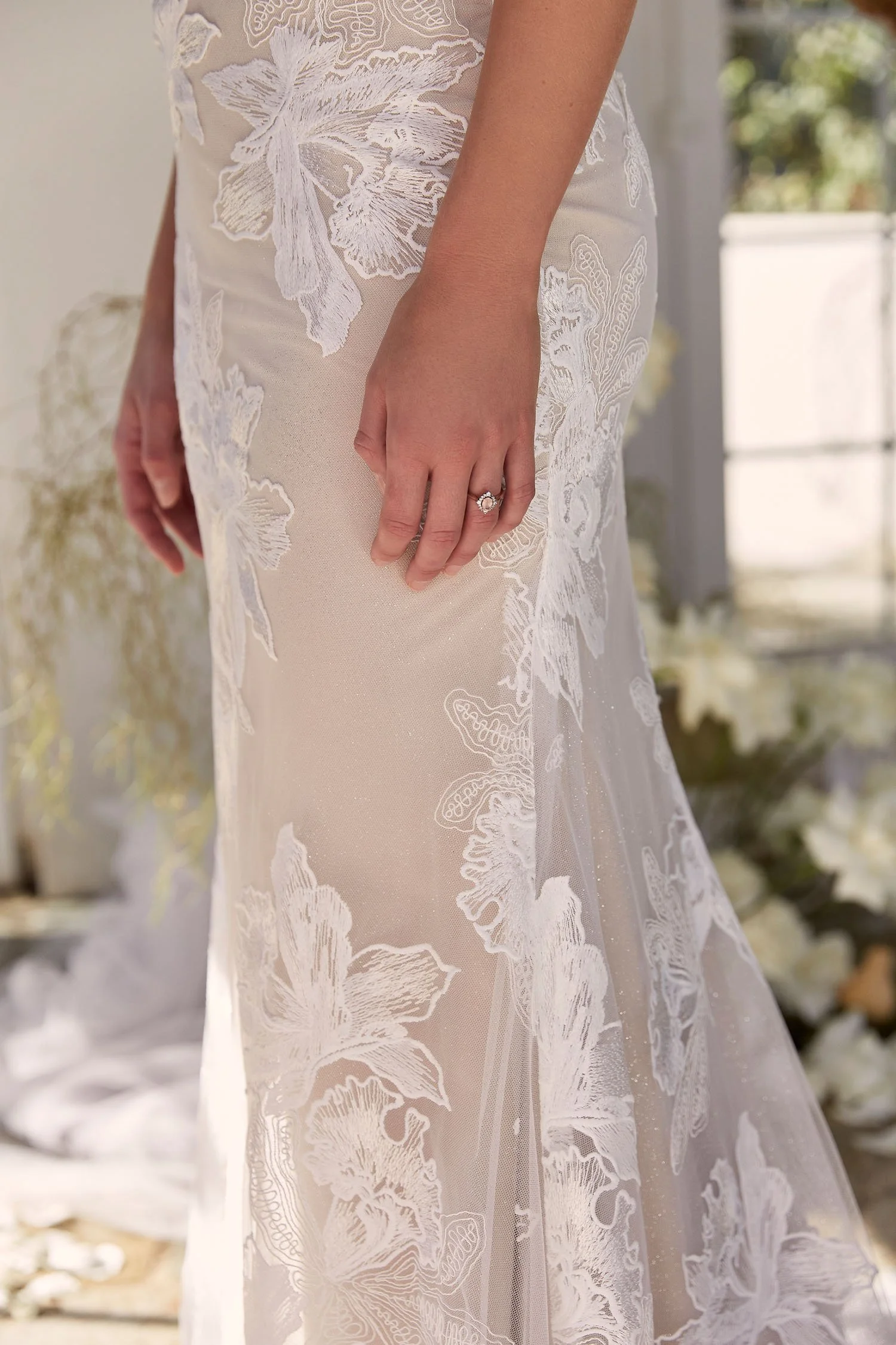 Madi Lane Daria ML22222GT fit-and-flare wedding dress with illusion bodice, bold floral lace and shimmer tulle