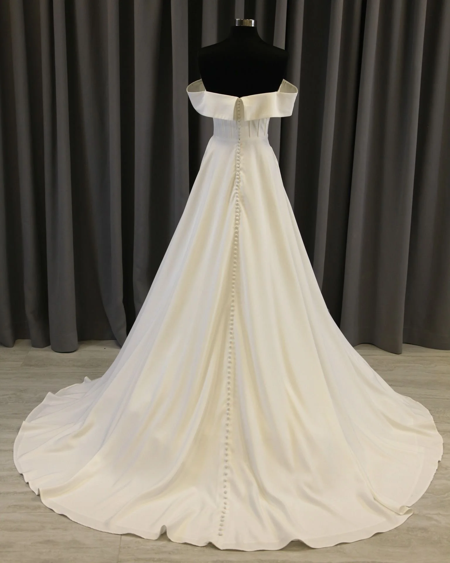 Liz Lou M23004 Simple Ivory A-line wedding dress with off-the-shoulder neckline, bridal sample size 12, available at Olive and Ivory in Sacramento