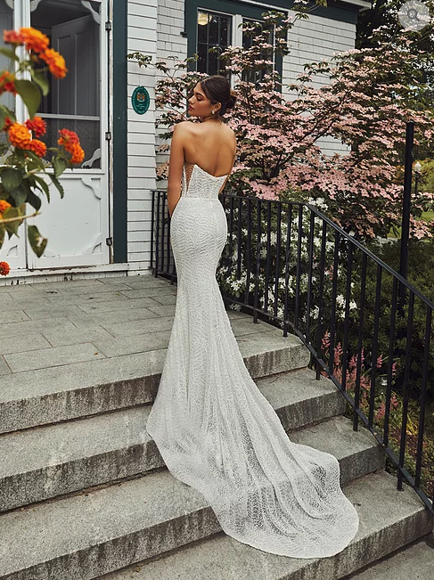 Calla Blanche Henrietta 120114 beaded lace sheath wedding dress with plunging sweetheart neckline, bodice side cutouts, and sculpting liner