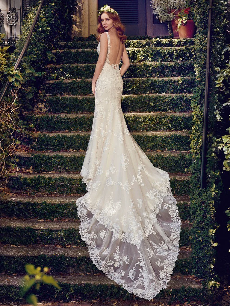 Maggie Sottero Zamara 8MS492 tulle sheath wedding gown with V-neckline, illusion straps, shimmering lace motifs, and illusion double-train
