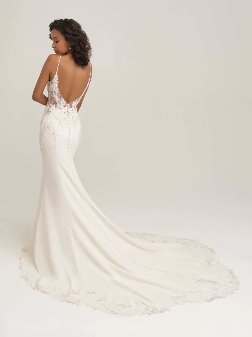 Allure Romance 3450 sheath wedding gown with V-neckline, beaded lace appliqués trailing down the bodice, and crepe fabric for a sleek, sparkling bridal look.