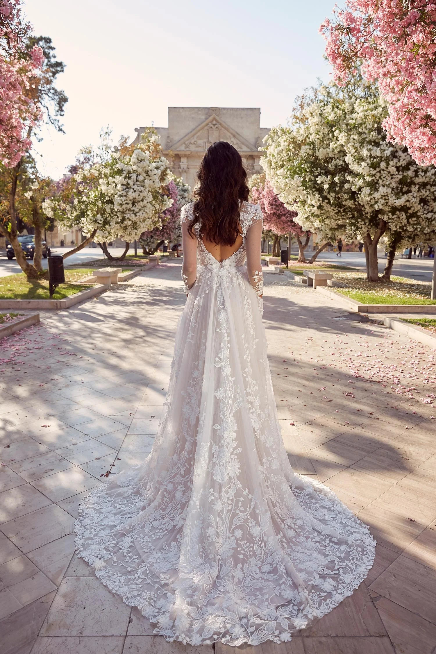 Madi Lane Meadow ML10994 A-line wedding dress with botanical embroidery, 3D floral lace, sheer long sleeves, and keyhole back