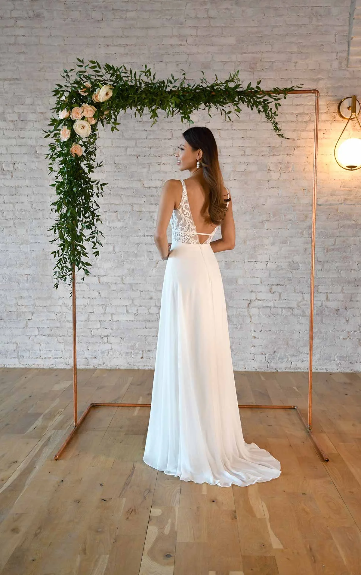 Stella York 7302 V-neck A-line wedding dress with lace bodice and chiffon skirt in Ivory