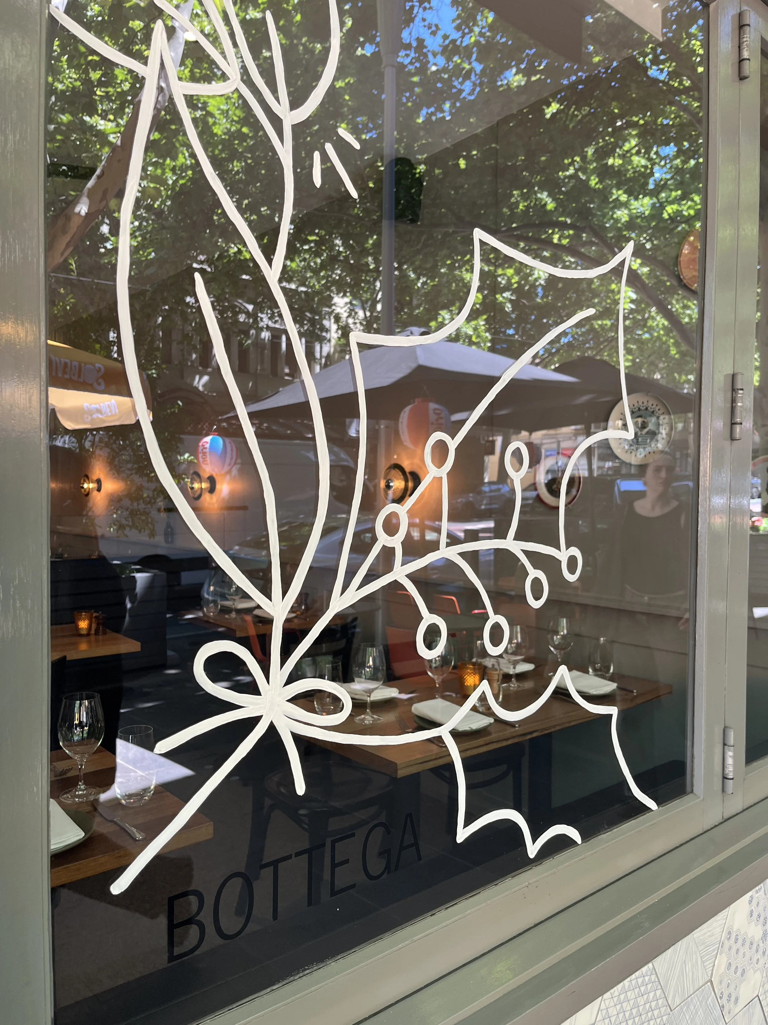 Festive, Christmas Window Painting. Window painting for retail stores Angharad Neal-Williams