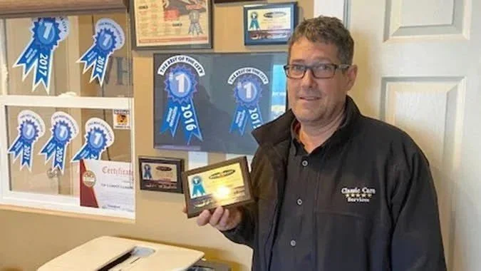 Classic Care Carpet Cleaning owner accepting Best in the City award for 11 consecutive years in Nanaimo and Parksville