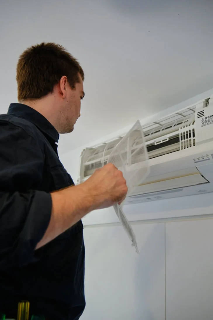 Behind-the-scenes look at a professional in Brisbane rejuvenating an air conditioner to its optimal state. Protect your investment and ensure maximum efficiency with our trusted services