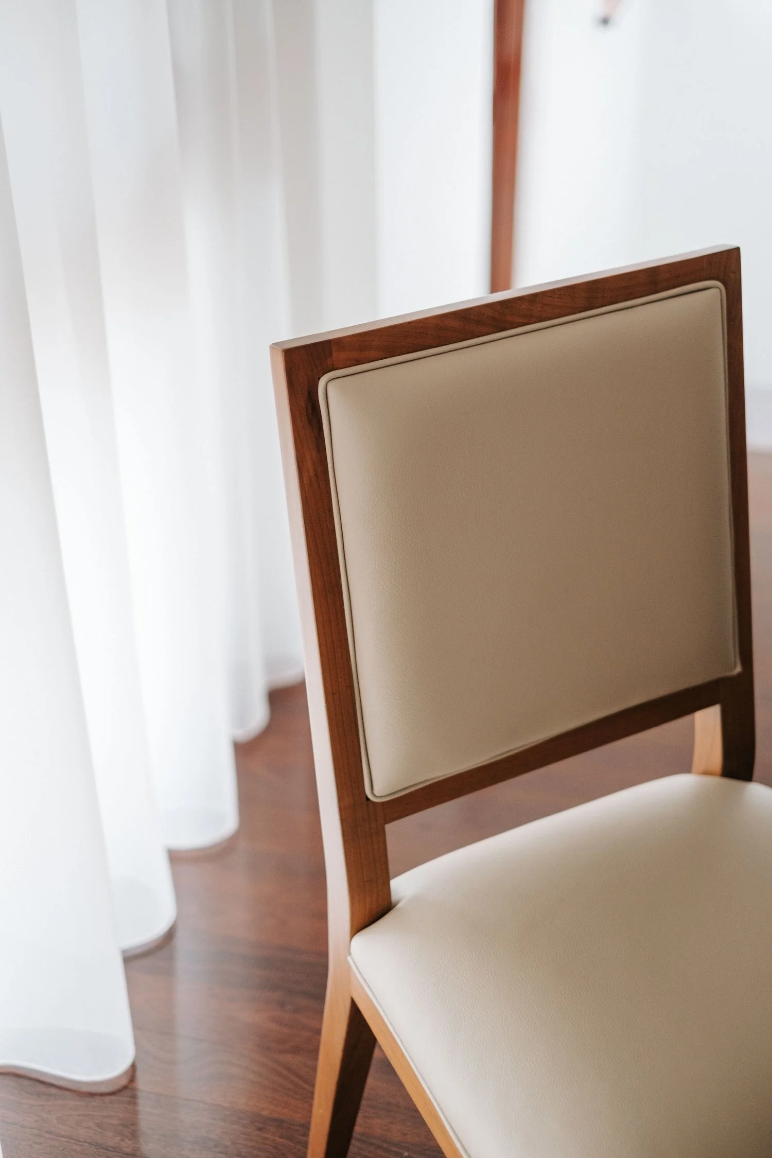 Custom dining table and upholstered dining chairs selected for a Perth interior. 