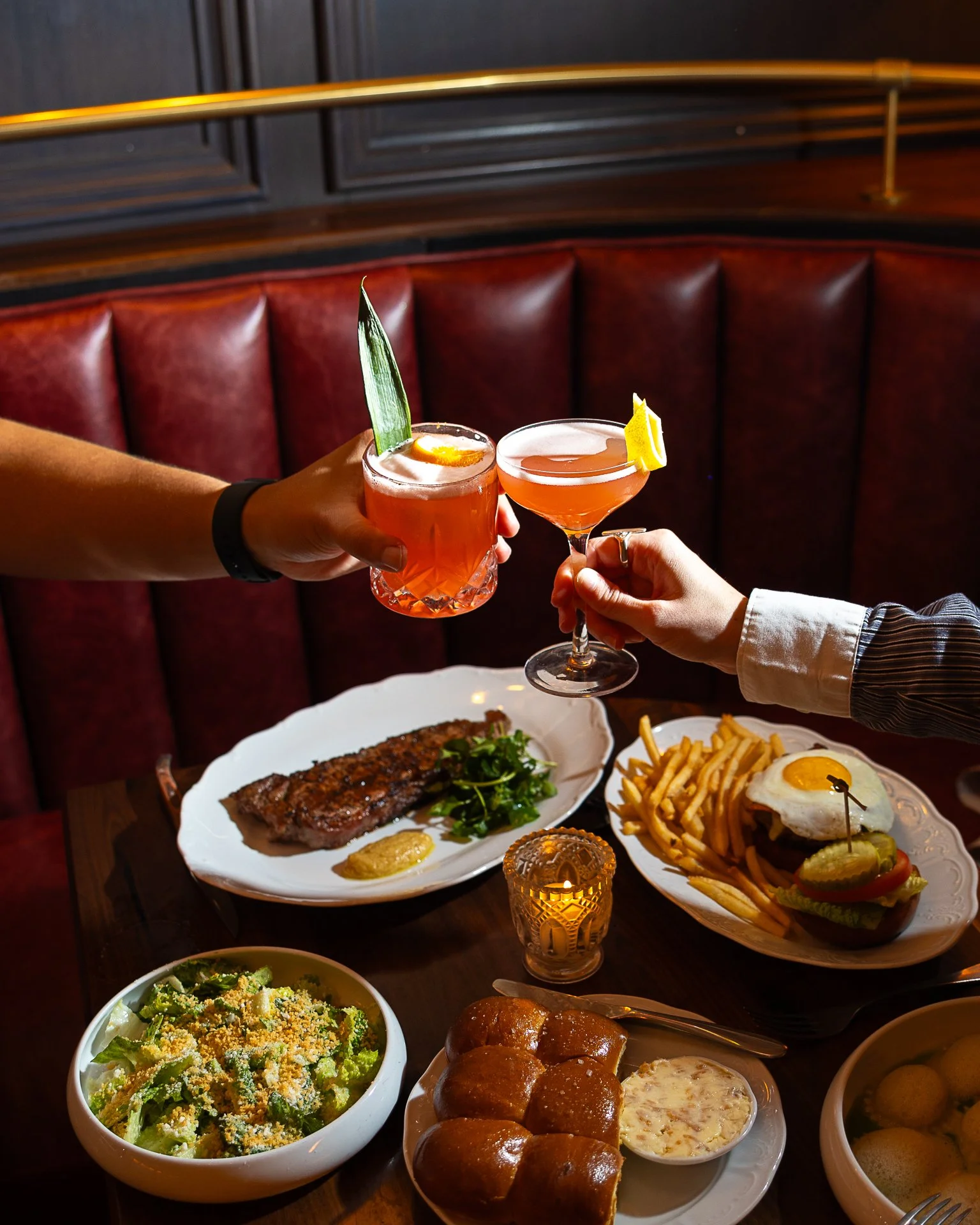 Dinner, done right. 🥂 From Parker House Rolls with shallot butter and sea salt to our 12oz NY Strip, mushroom ravioli, Caesar salad, and a cheeseburger topped with bacon and egg, this is the kind of spread made for unforgettable nights at Bar Lesieu