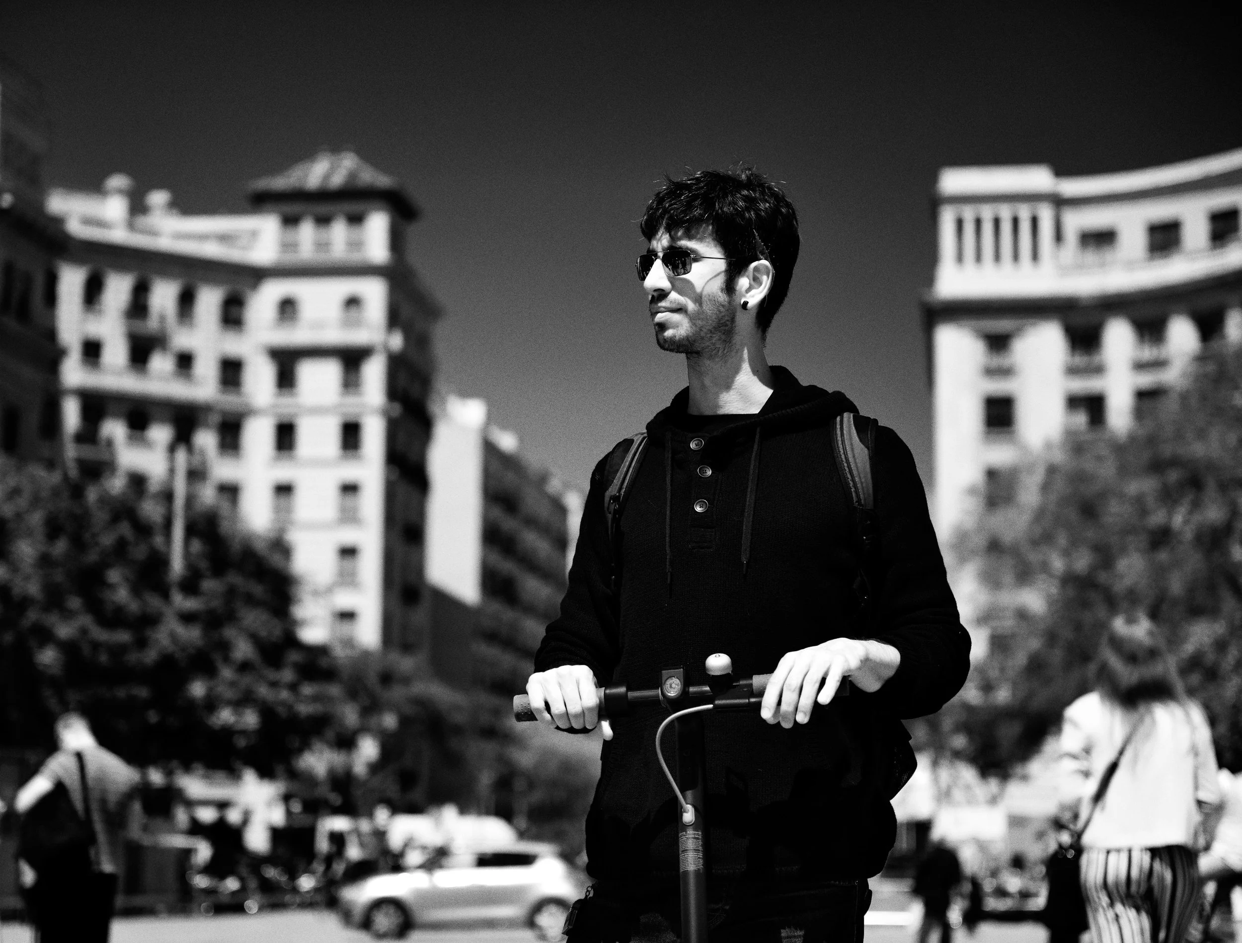 Barcelona Street portrait photography of man on scooter.