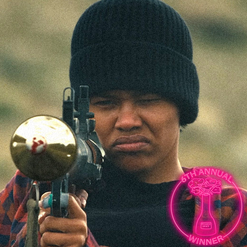 A woman and a man facing each other, smiling, with a sunset in the background. There is a circular logo in the bottom right corner that reads: 'The 5th Annual Dillweed Society Excellence in Film Awards Winner.'