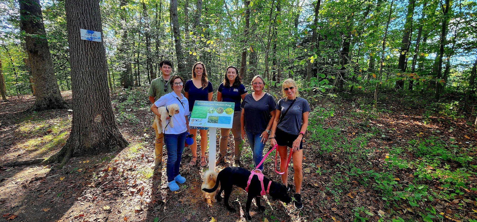 CER Program Manager, Nita Settina,  members of the Arden Community, including Kim Franklin, Anne Arundel County, Sally Albright, and Underwood & Associates, Keith Binsted and Amanda Poskaitis celebrate the new interpretive sign.
