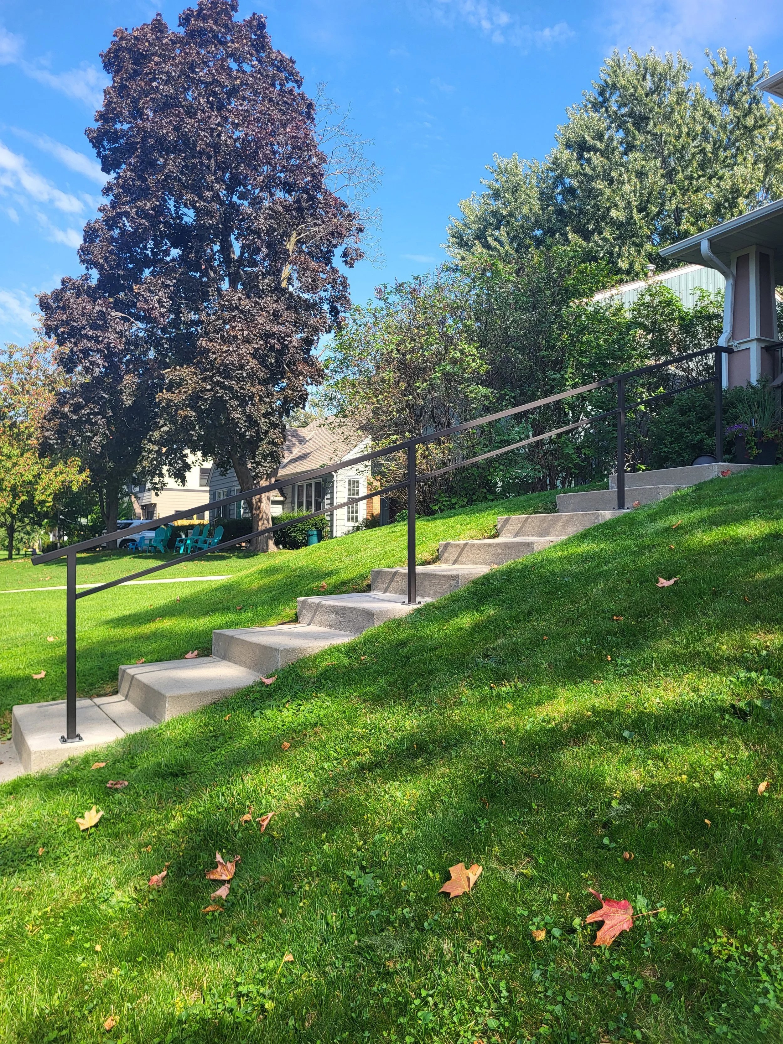 <img src="your-image.jpg" alt="Durable metal railings with custom powder coating, designed and installed by our company.">