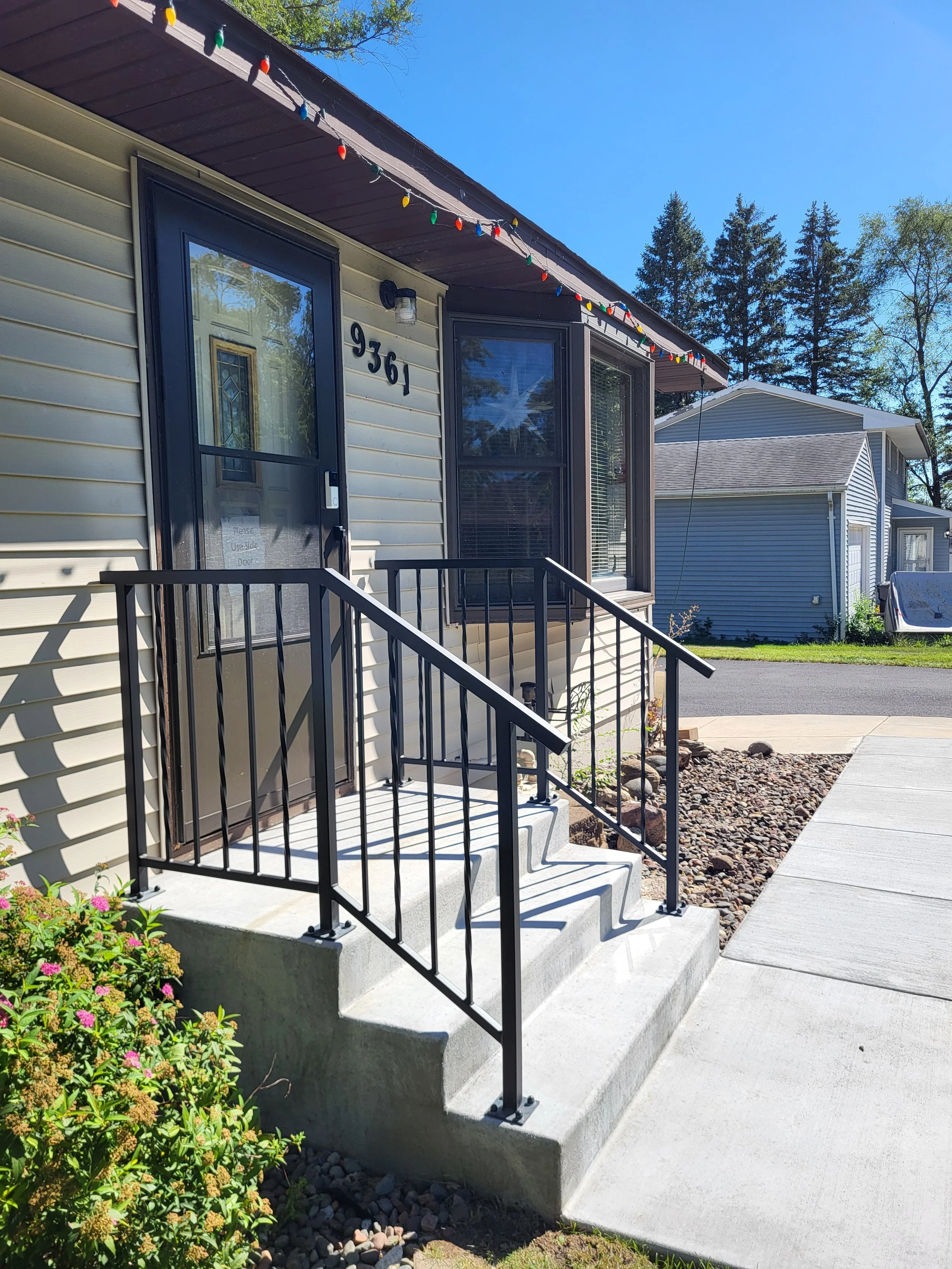 <img src="your-image.jpg" alt="Durable metal railings with custom powder coating, designed and installed by our company.">