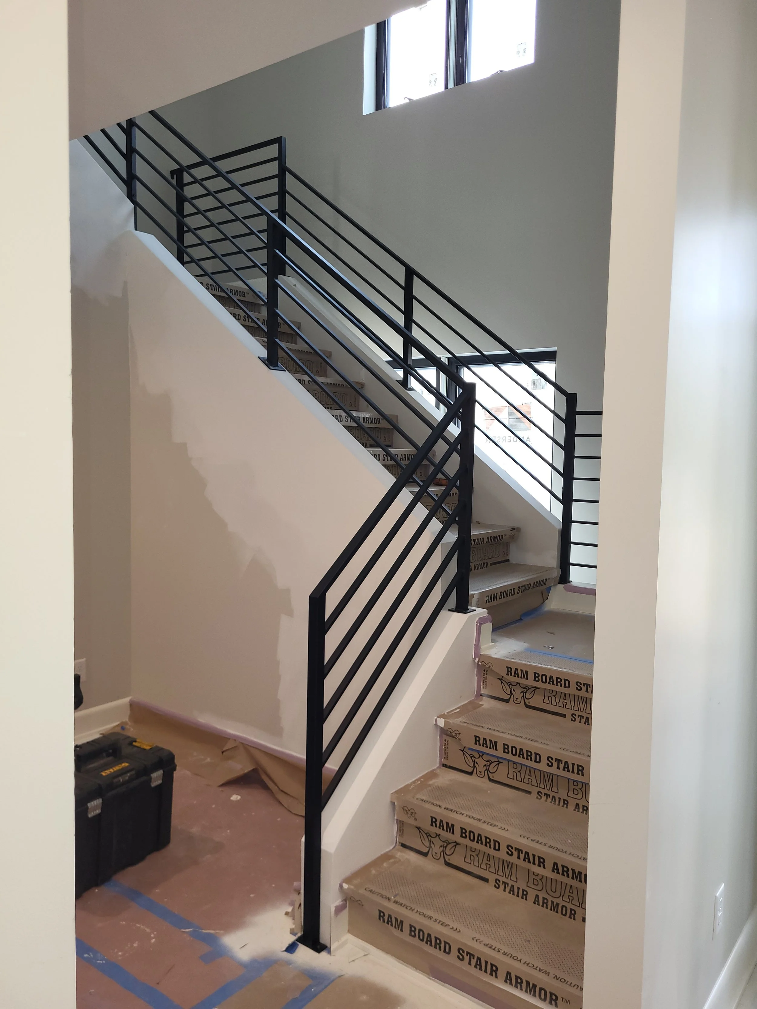 <img src="your-image.jpg" alt="Durable metal railings with custom powder coating, designed and installed by our company.">