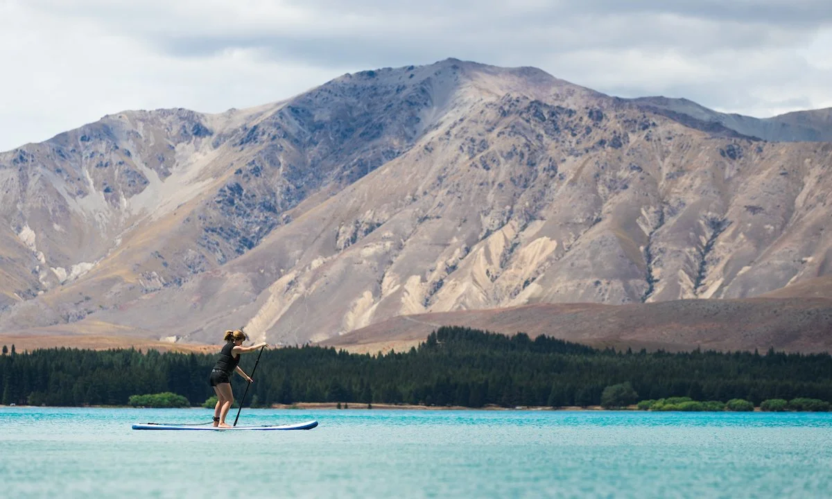 A summer paddle on the blue Lake Tekapo, New Zealand. | Photo: Johny Cook