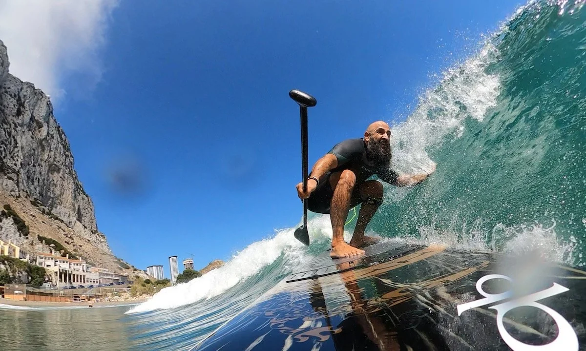  Trailing my hand on a glassy wave as I sup surf the Hypr Kaimana 10,6 on a perfect day at Catalan Bay village. When the planets align and the conditions are good at this quaint little Mediterranean village the lefts come pumping in constantly and cl