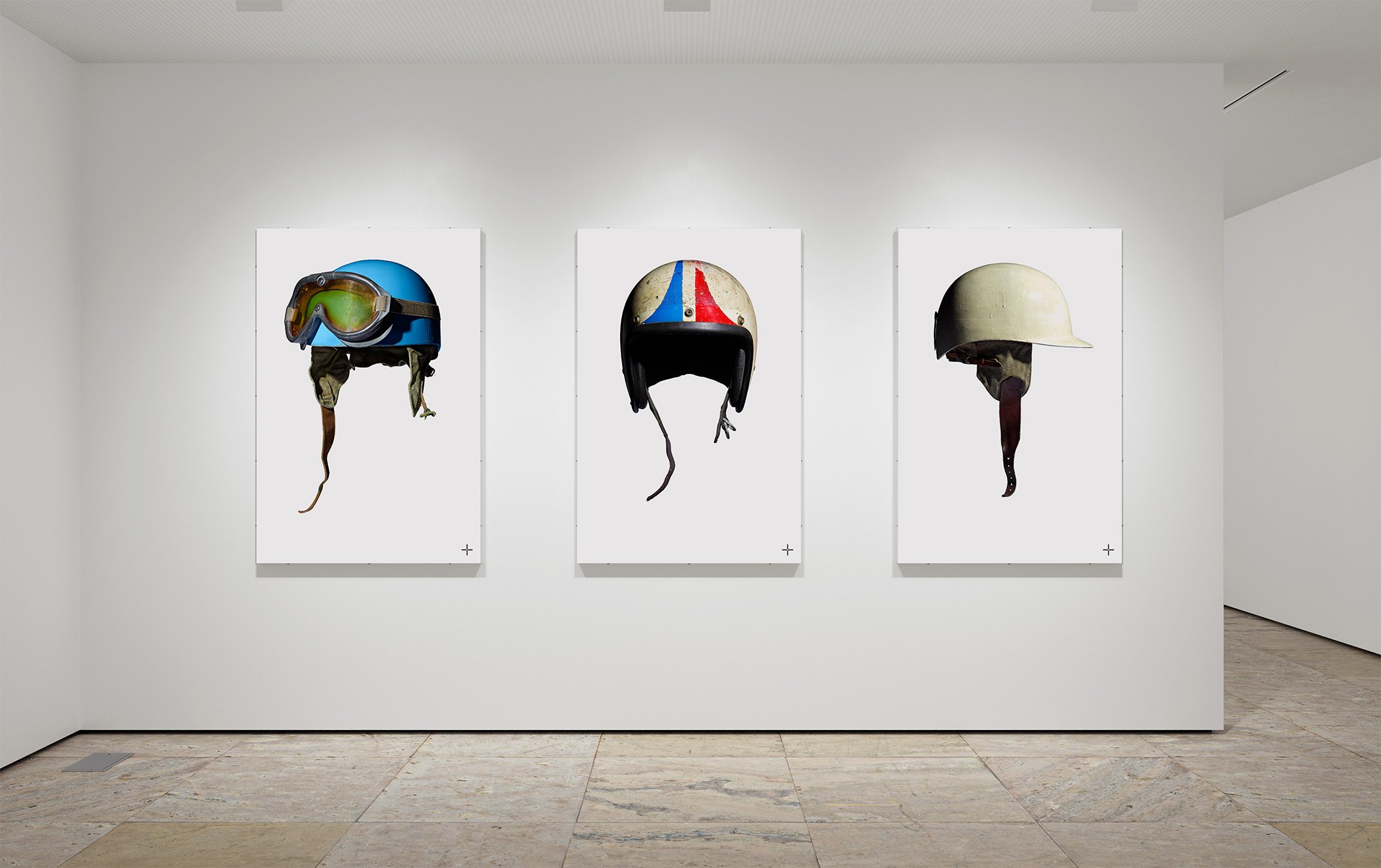 White Cube gallery space with fine art prints of Grand Prix winning Formula 1 race worn helmets belonging to Ascari, Amon and Moss. Visually striking artworks of iconic race helmets available for all dedicated fans of motor racing.