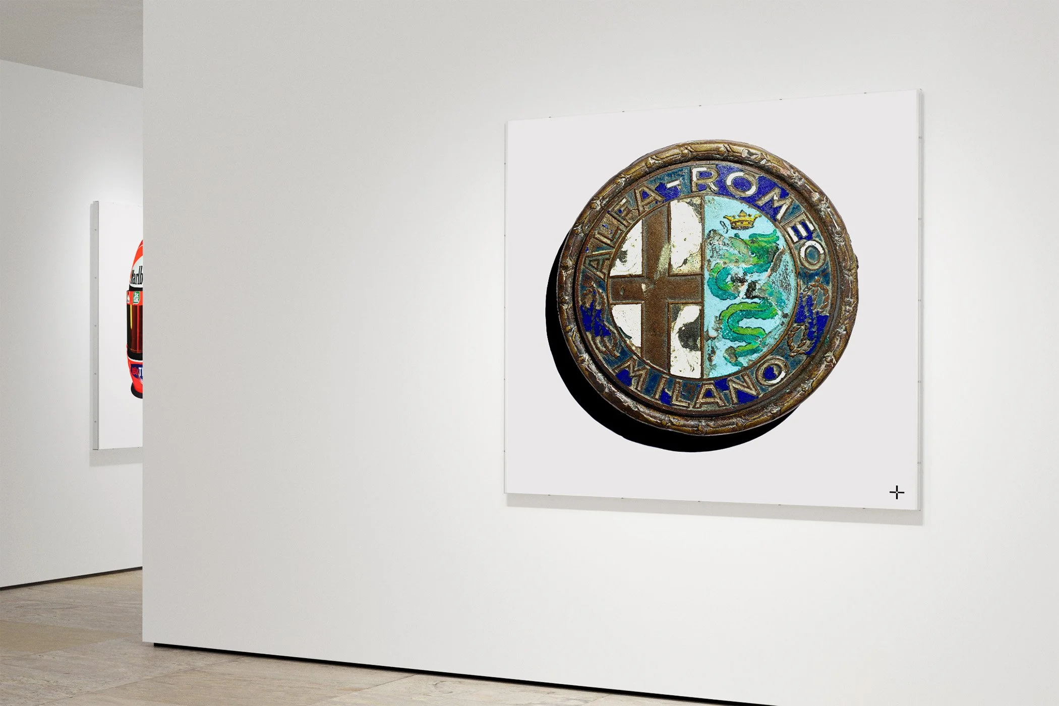 White Cube gallery space with fine art prints of Grand Prix winning Formula 1 race worn helmets belonging to Michael Schumacher and petroliana. Visually striking artworks of iconic racing memorabilia, available for all dedicated fans of motor racing.