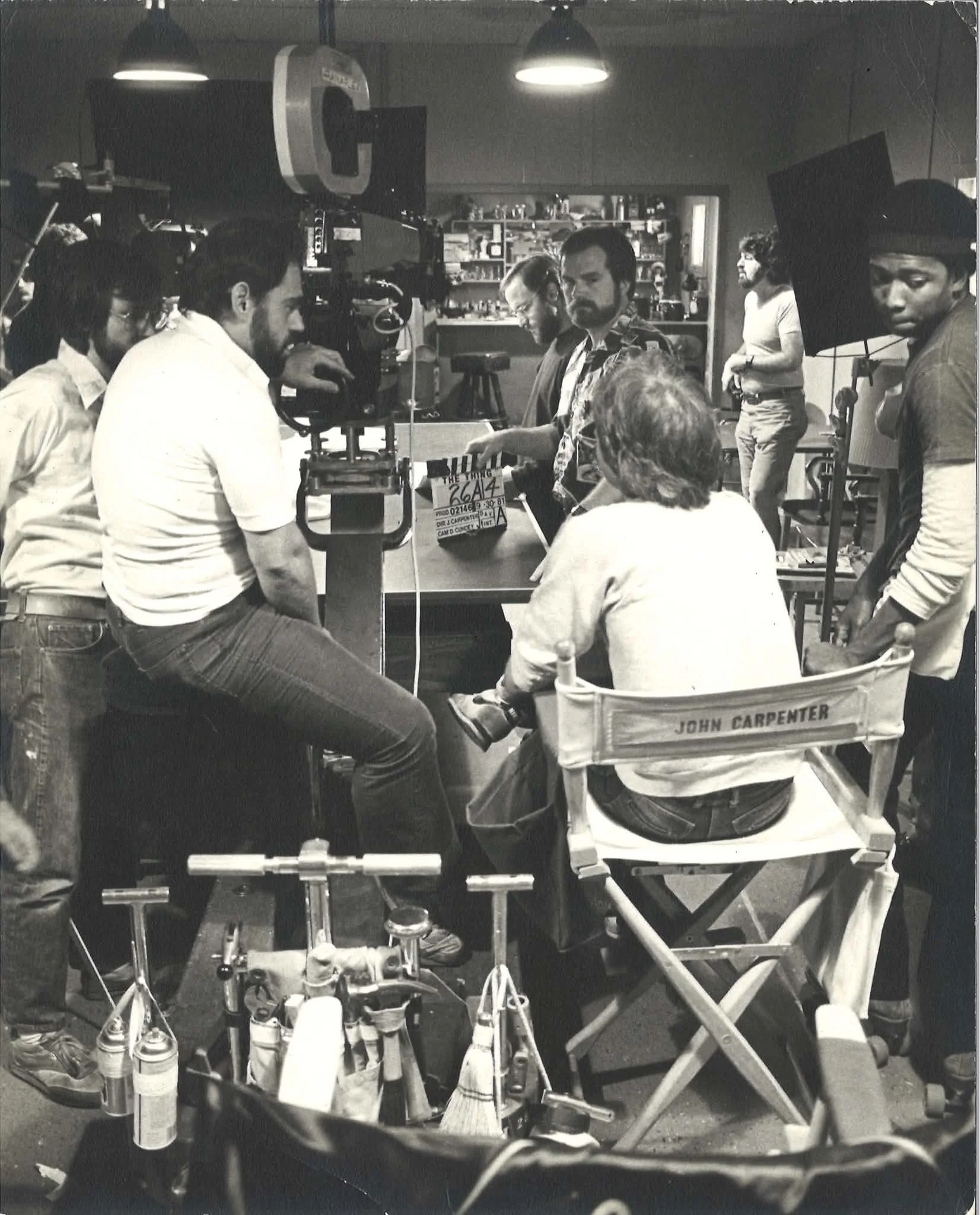 The Thing, 1982. Steve Tate (holding the slate), John Carpenter and operator Ray Stella talk in between takes.